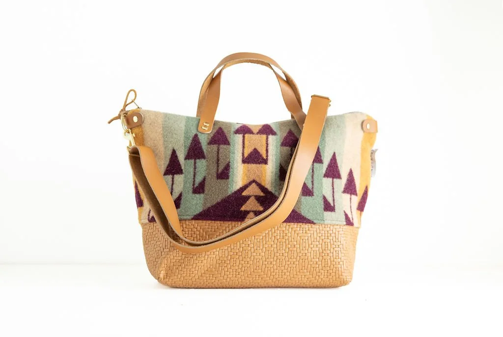 Short Arrow wool crossbody purse shown with detailed angles and unique leather accents