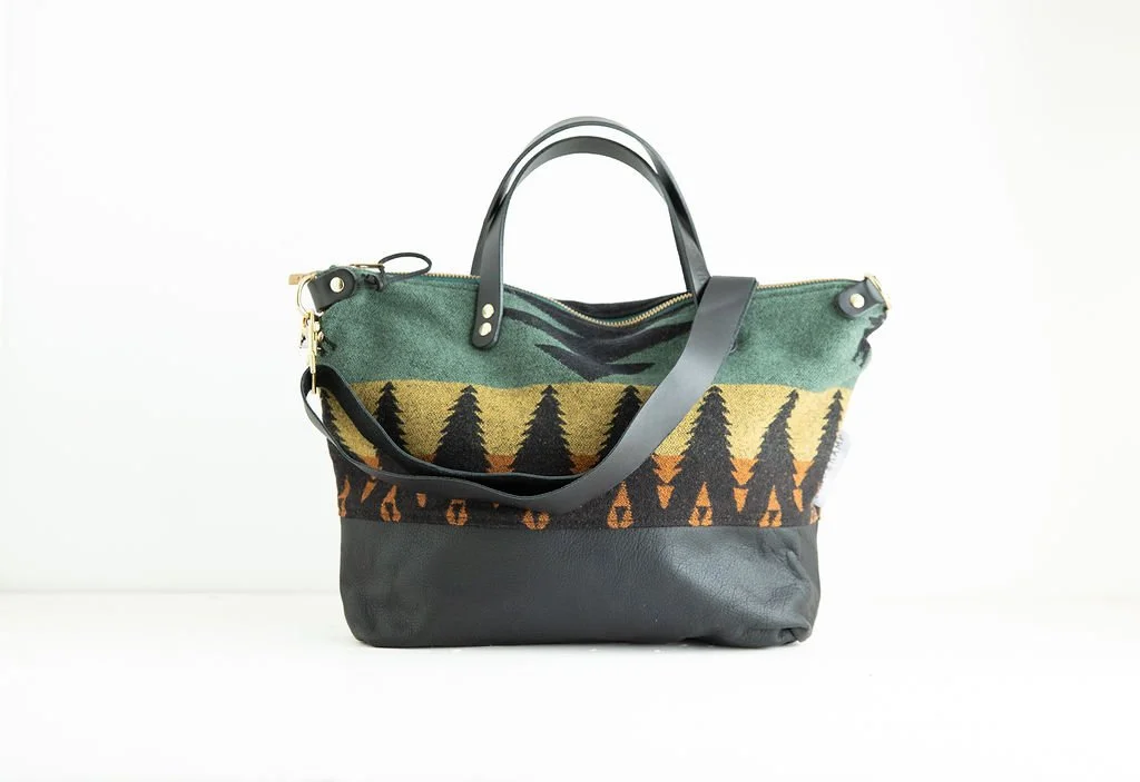 Tree Line wool crossbody purse shown with detailed angles and top-grain leather handles