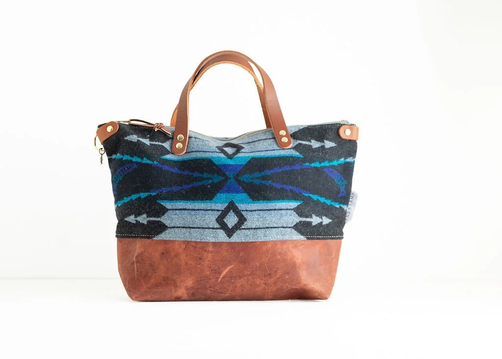 Handmade River Salmon wool crossbody purse with dark blue salmon pattern jumping upstream, leather bottom, crafted in Portland
