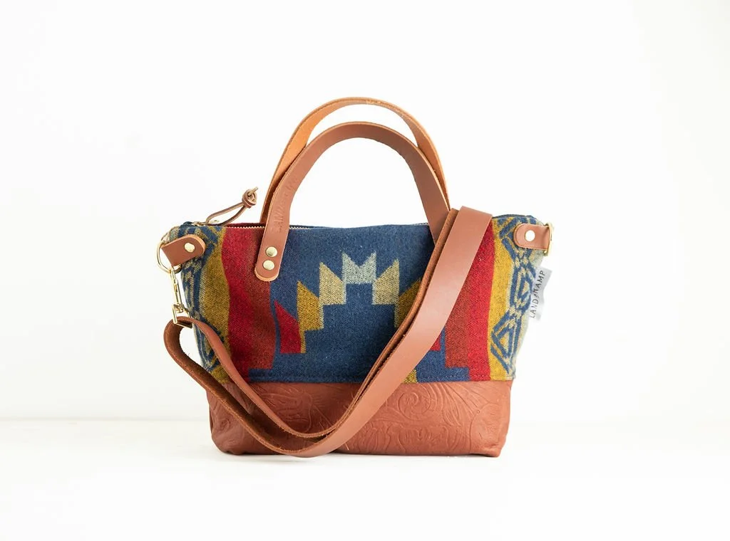 Stamped leather Detail view of the Wool Bitsy Crossbody Purse | Vintage Blue featuring YKK zipper and leather trim by Land & Kamp