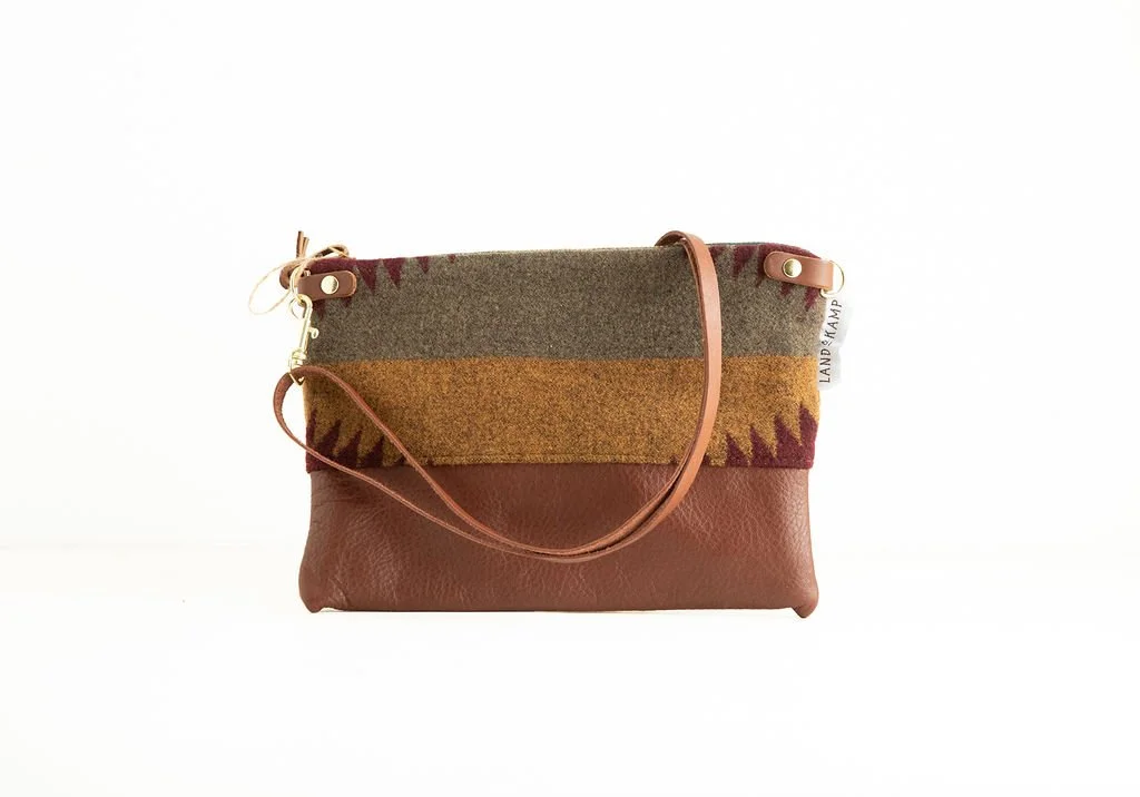 Detail view of the Sagebrush wool 3-in-1 wristlet bag featuring YKK zipper and leather trim by Land & Kamp