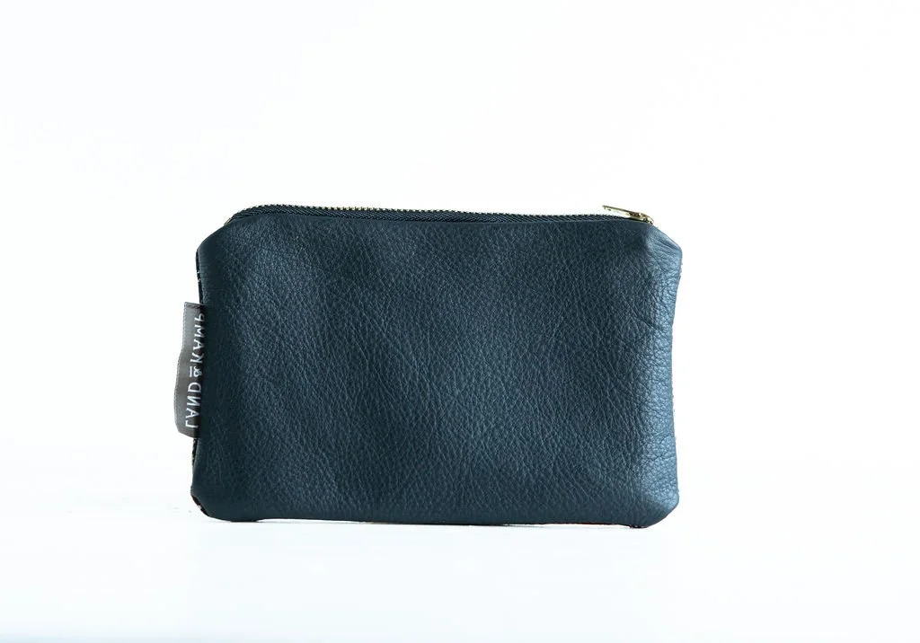 Backside in black leather Detail view of the Grey Stewart Tartan wool pouch featuring YKK zipper and leather pull tag by Land & Kamp