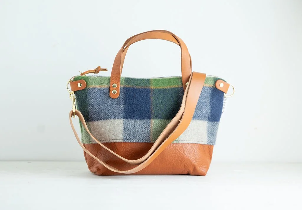Detachable strap Detail view of the Wool Bitsy Crossbody Purse | Green and Blue Plaid featuring YKK zipper and leather trim by Land & Kamp