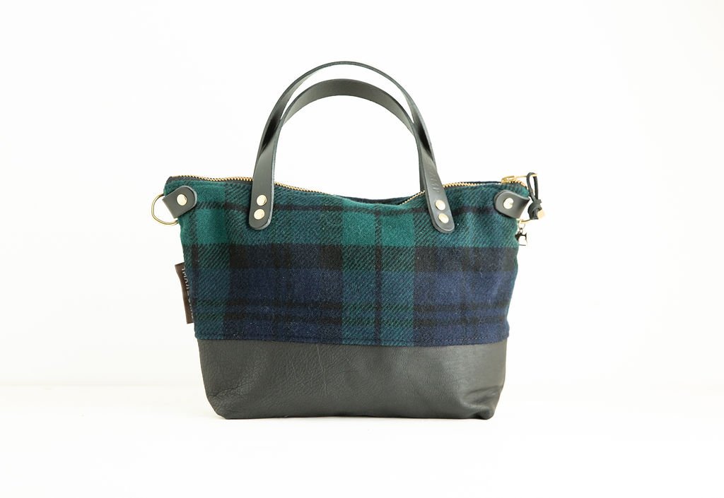 Detail view of the Wool Bitsy Crossbody Purse | Black Watch Tartan featuring YKK zipper and leather trim by Land & Kamp