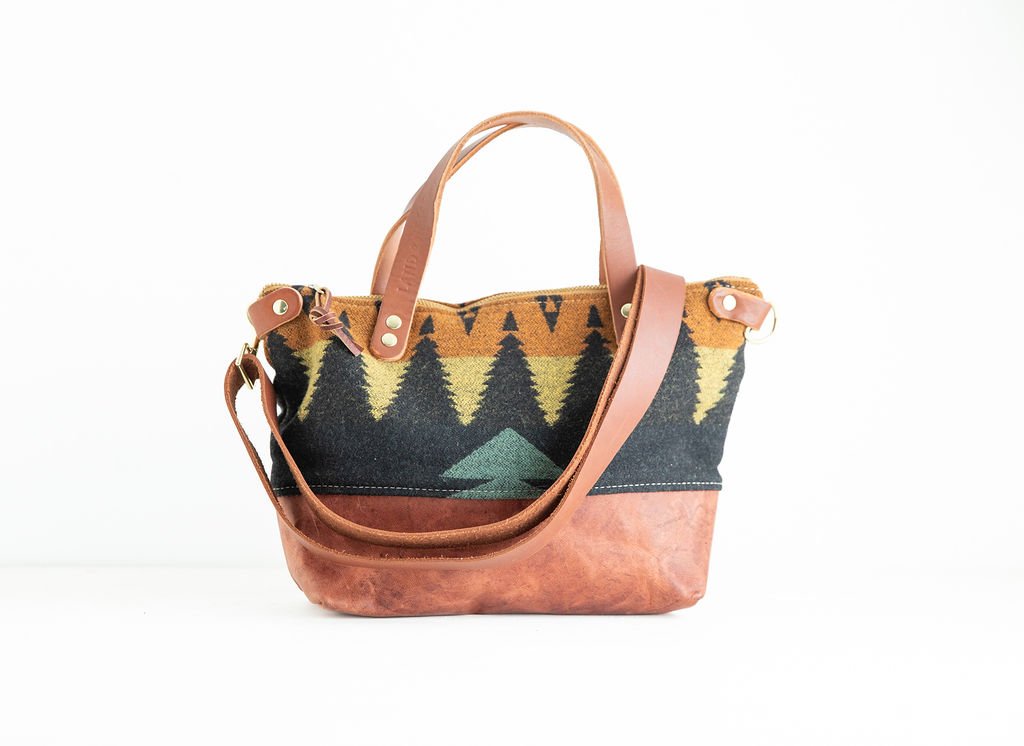 Detachable Strap Detail view of the Wool Bitsy Crossbody Purse | Tree Line featuring YKK zipper and leather trim by Land & Kamp