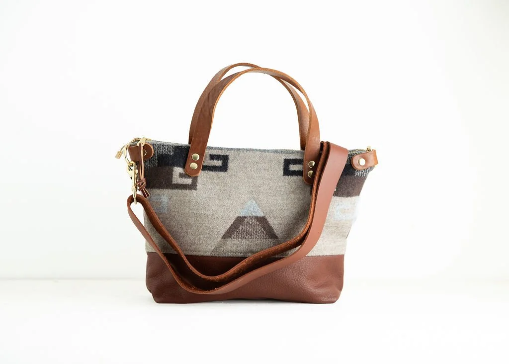 detachable strap Detail view of the Wool Bitsy Crossbody Purse | Tan Triangle featuring YKK zipper and leather trim by Land & Kamp