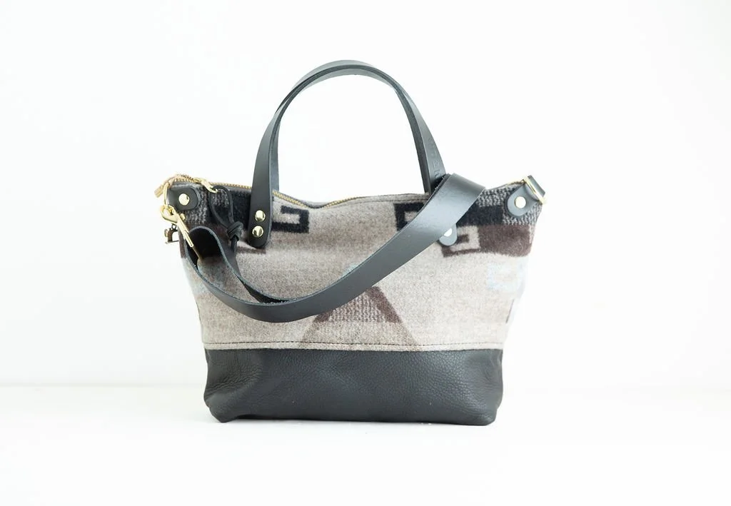 detachable strap Detail view of the Wool Bitsy Crossbody Purse | Tan Triangle featuring YKK zipper and leather trim by Land & Kamp