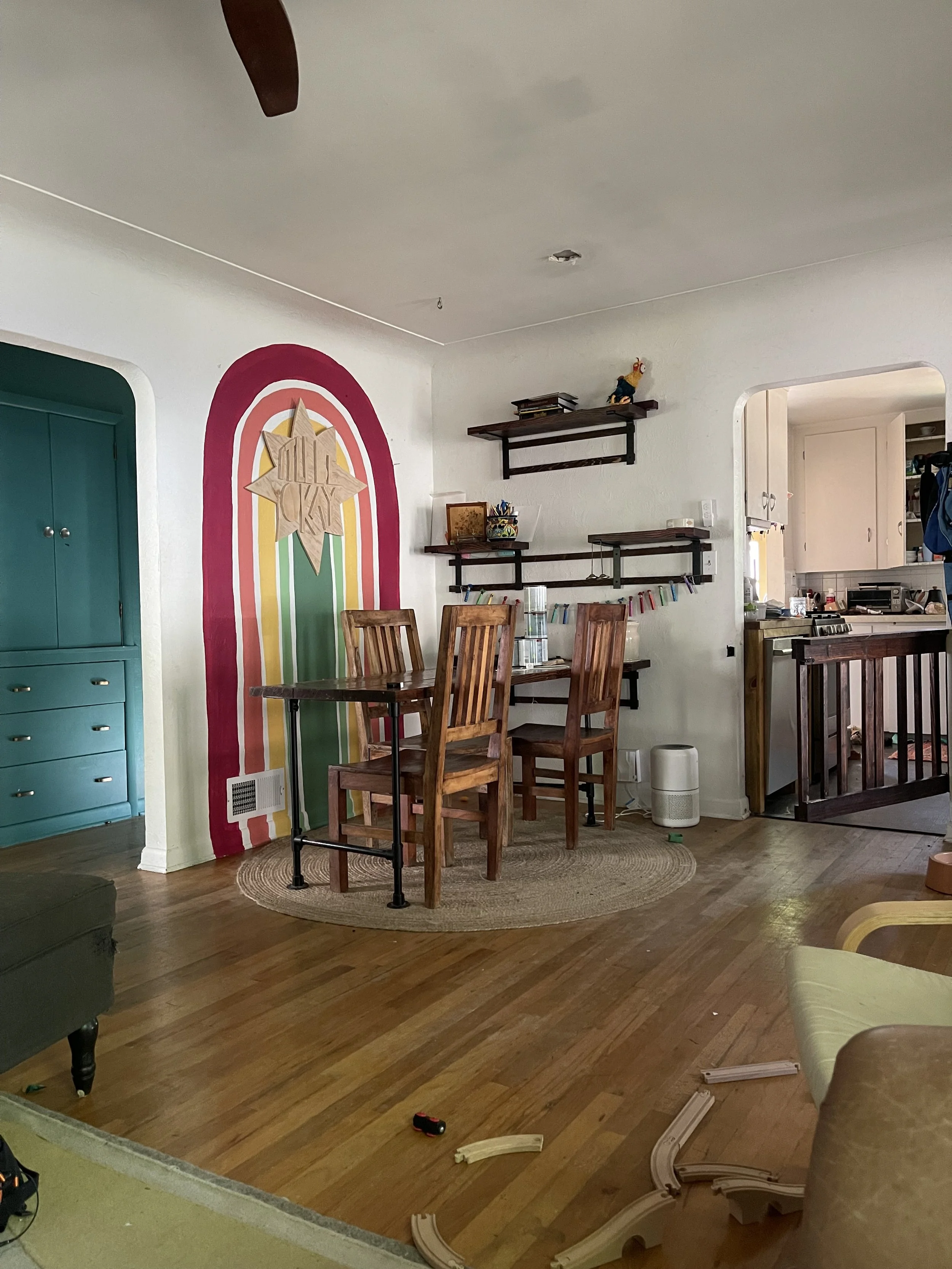 Rainbow mural and custom, hand cut wood sign.