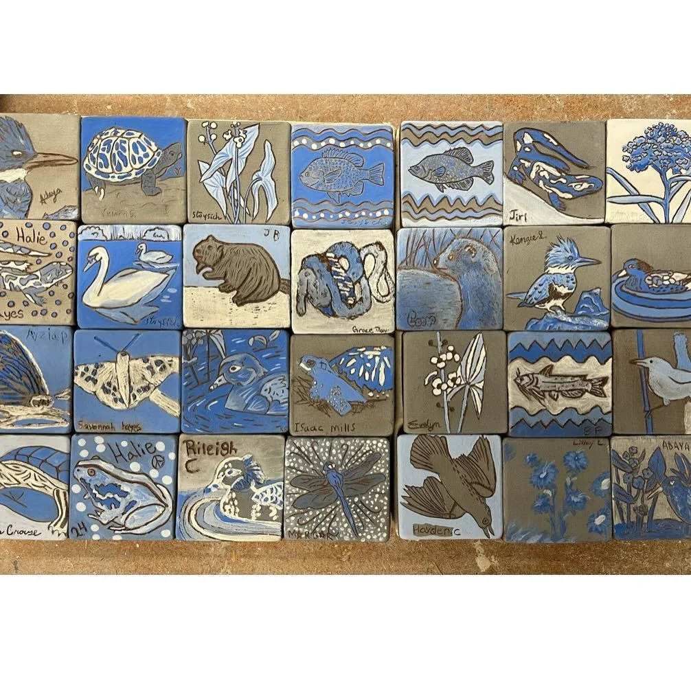 The tile mural was a community project. The blue and white tiles that make up the frame were made by high school students and families in Malvern. 

Swipe to see details of the finished tiles and photos and videos of the process. 

See the link in bi