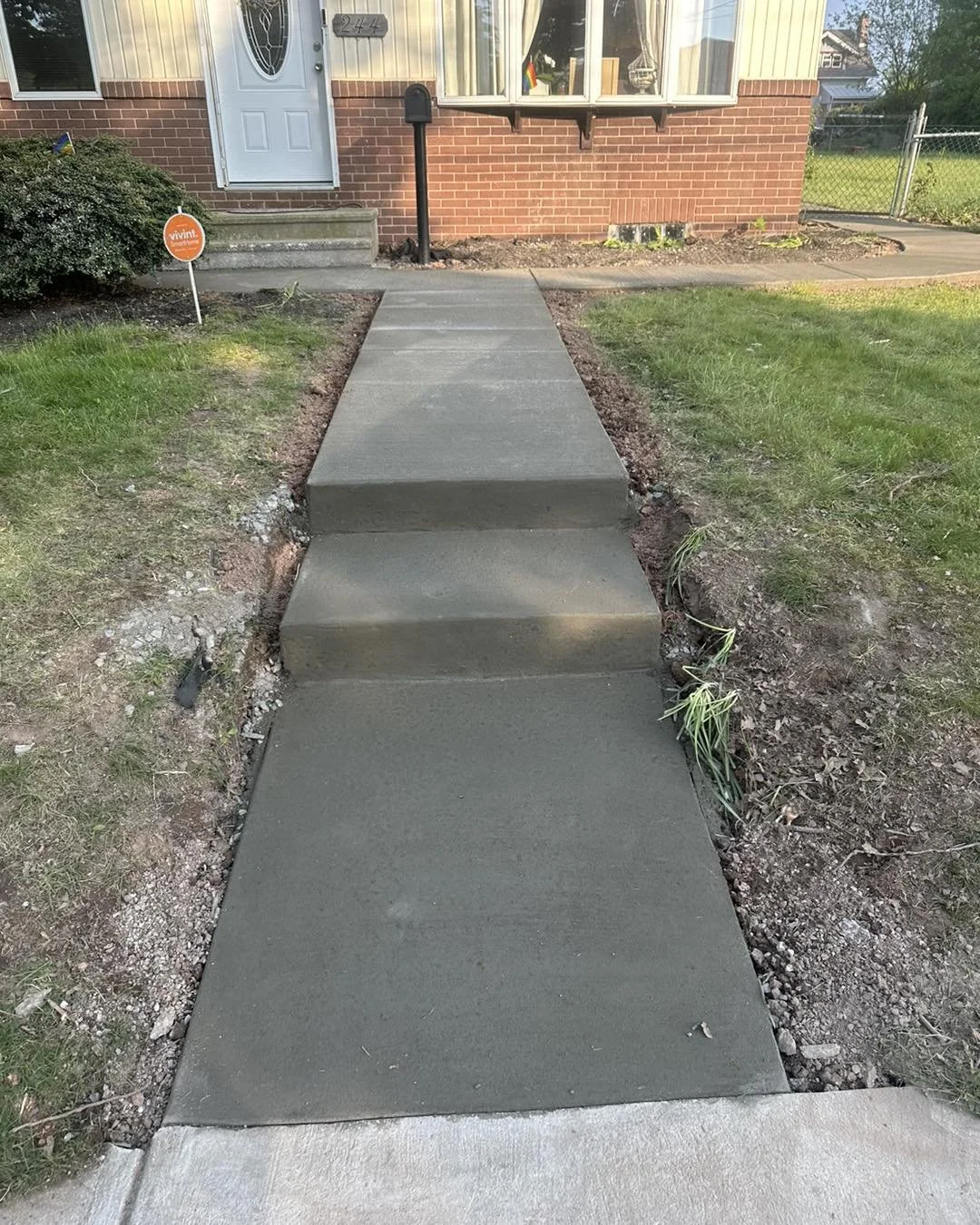 Concrete patio with a side walkway