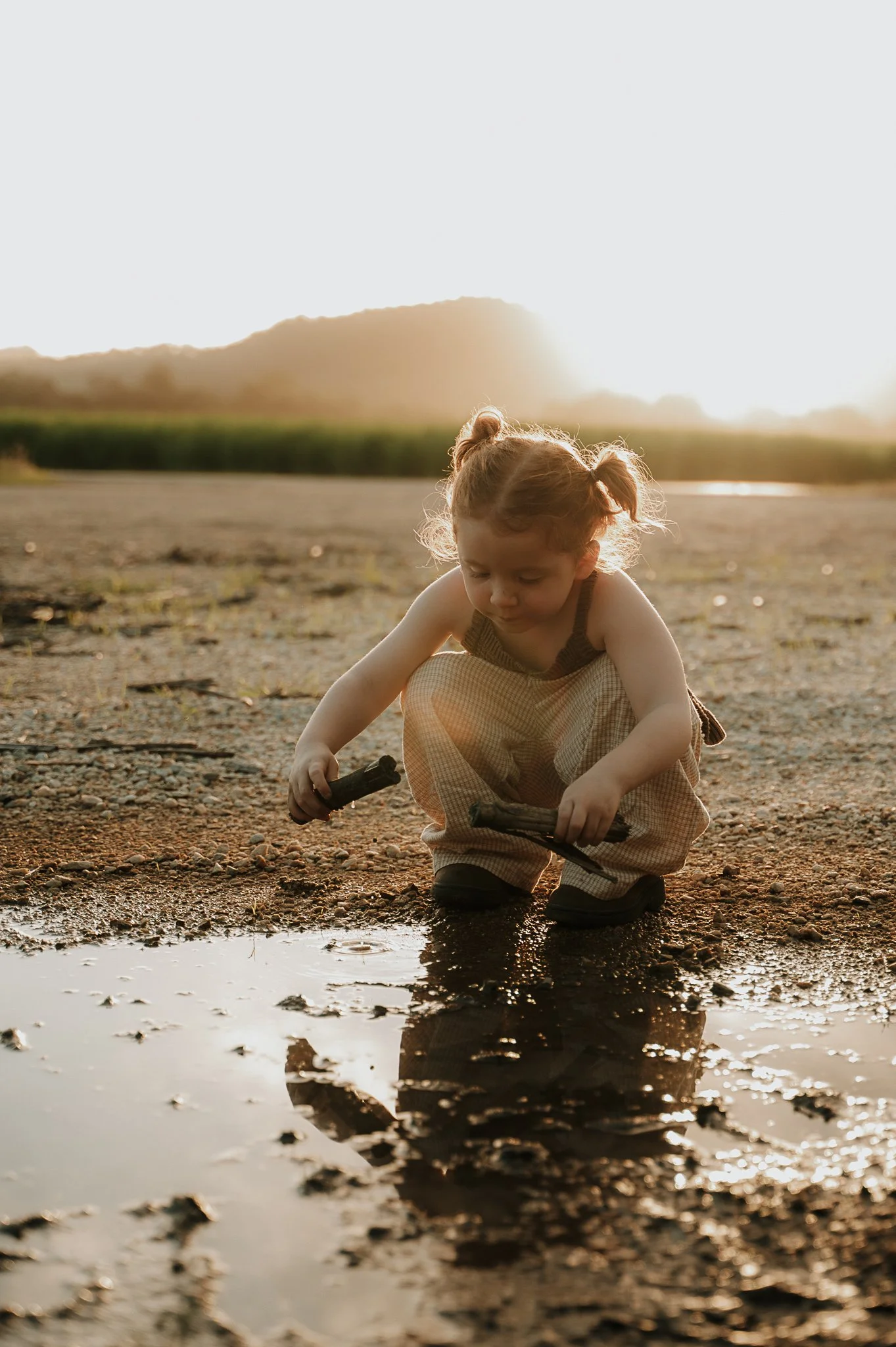 girl-crouching-sugar-cane-field-murwillumbah.jpg