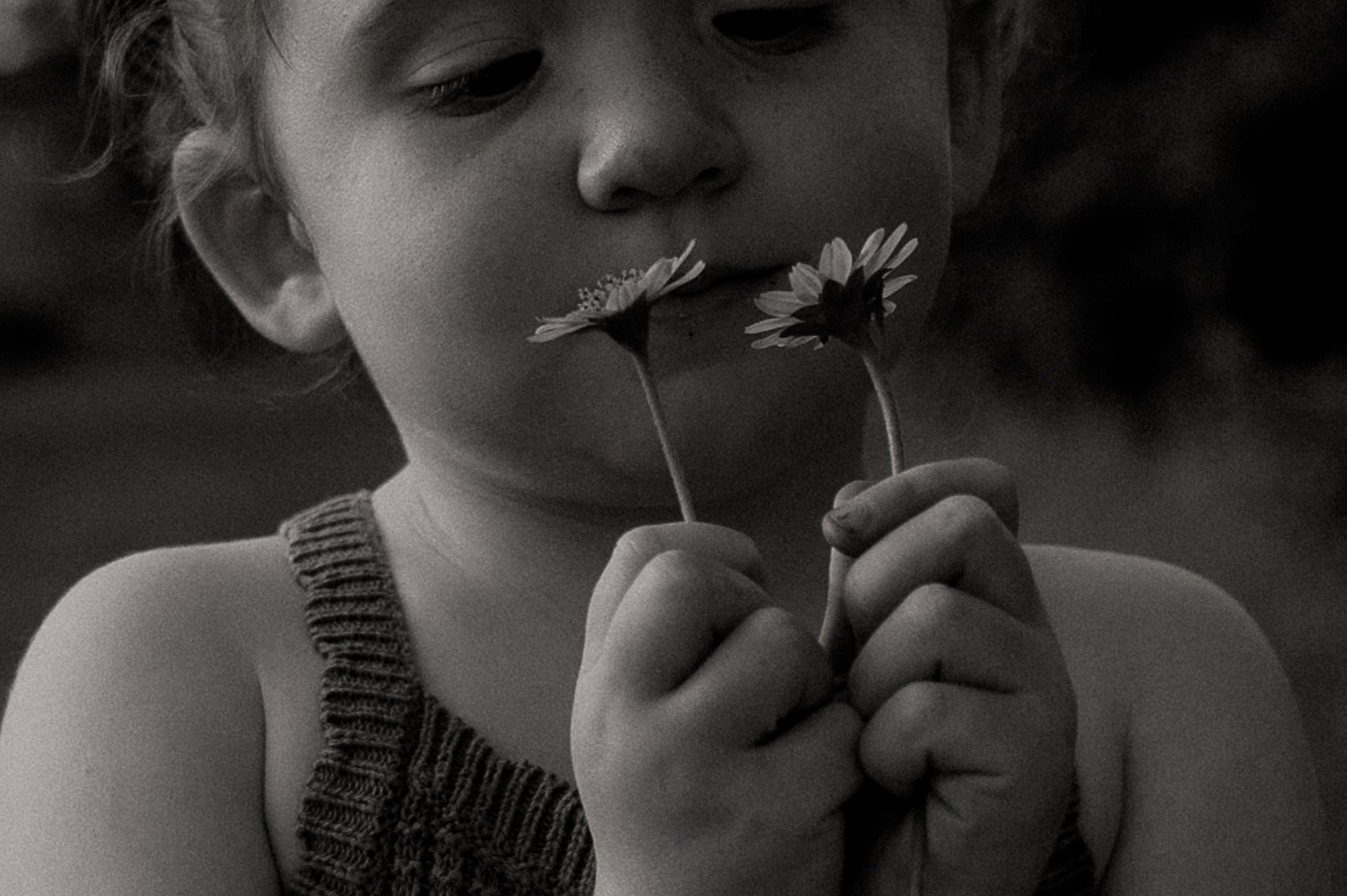 girl-holding-flowers-black-white-close-up.jpg