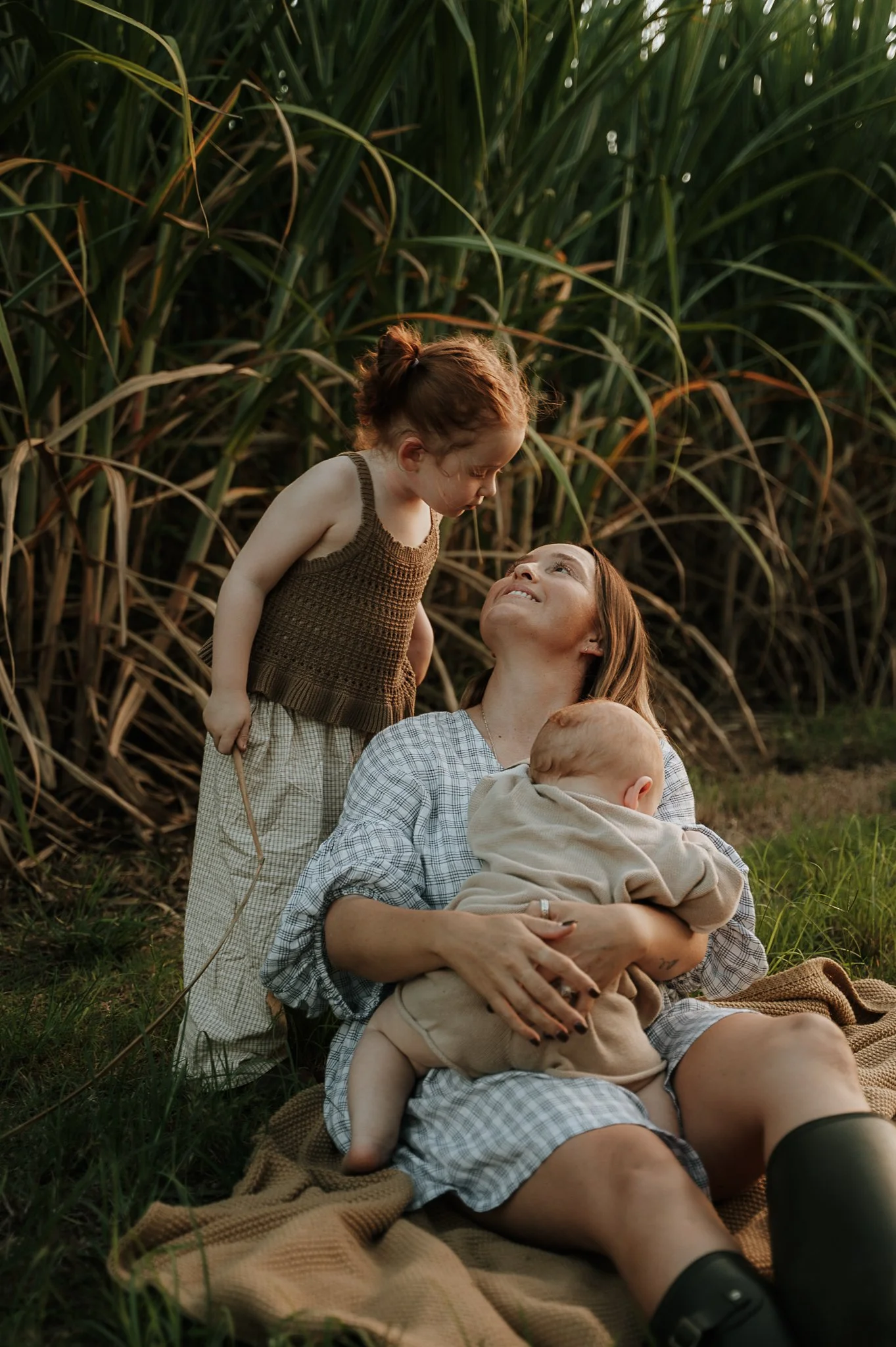 looking-up-at-mum-holding-the-baby.jpg
