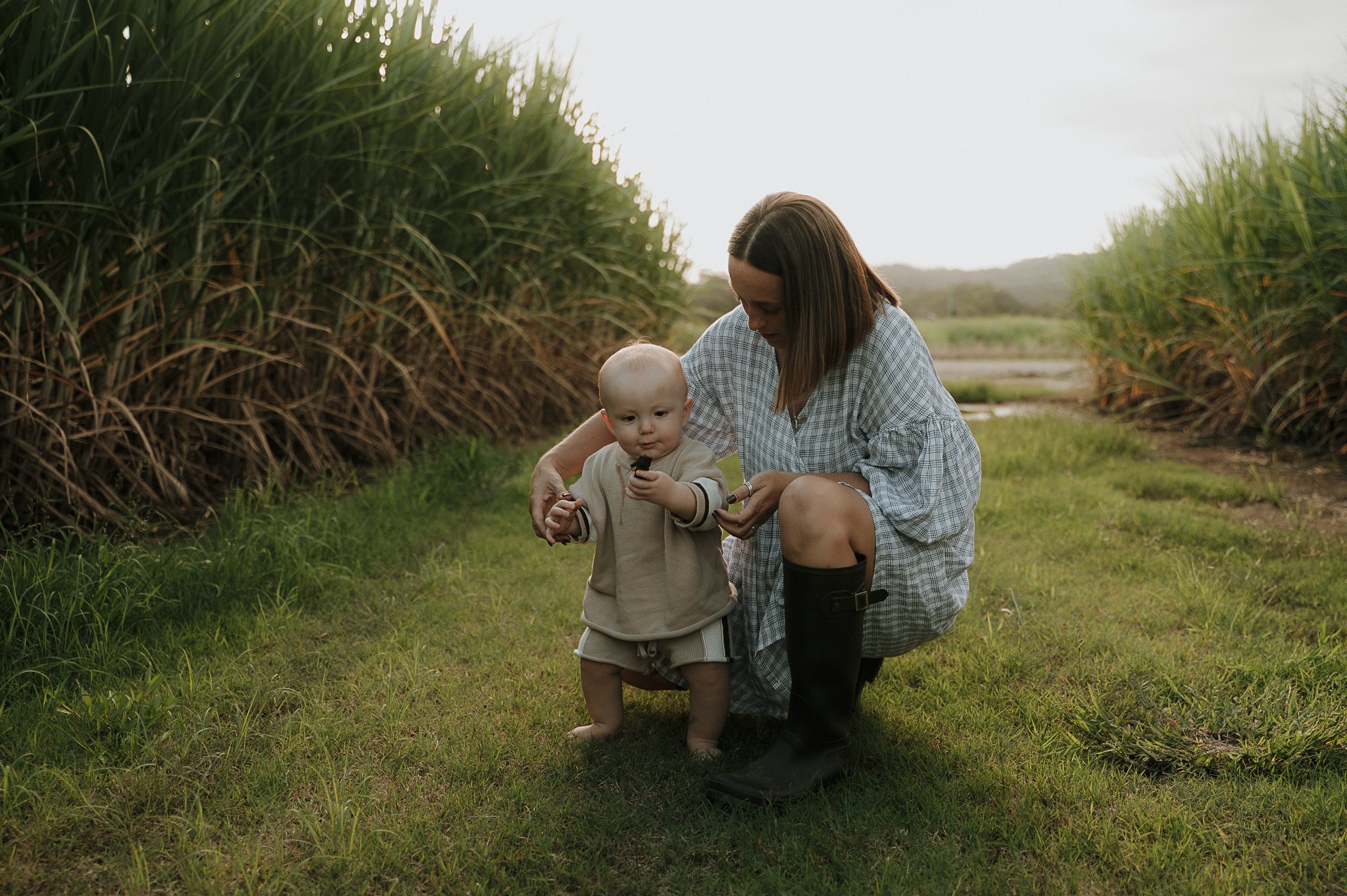 mother-crouching-baby-golden-hour-tweed-valley.jpg