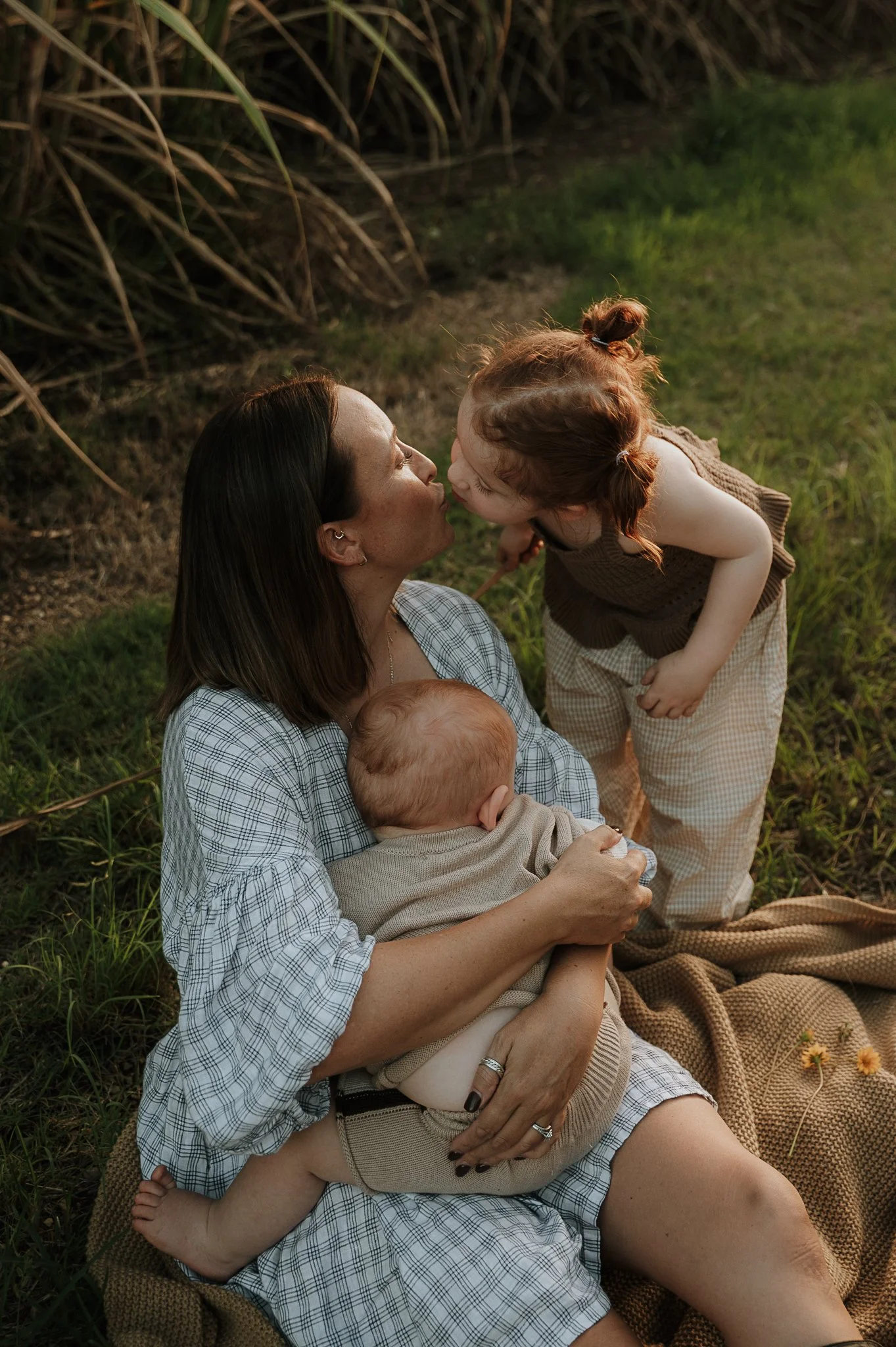 mother-kissing-baby-sugar-cane-field.jpg