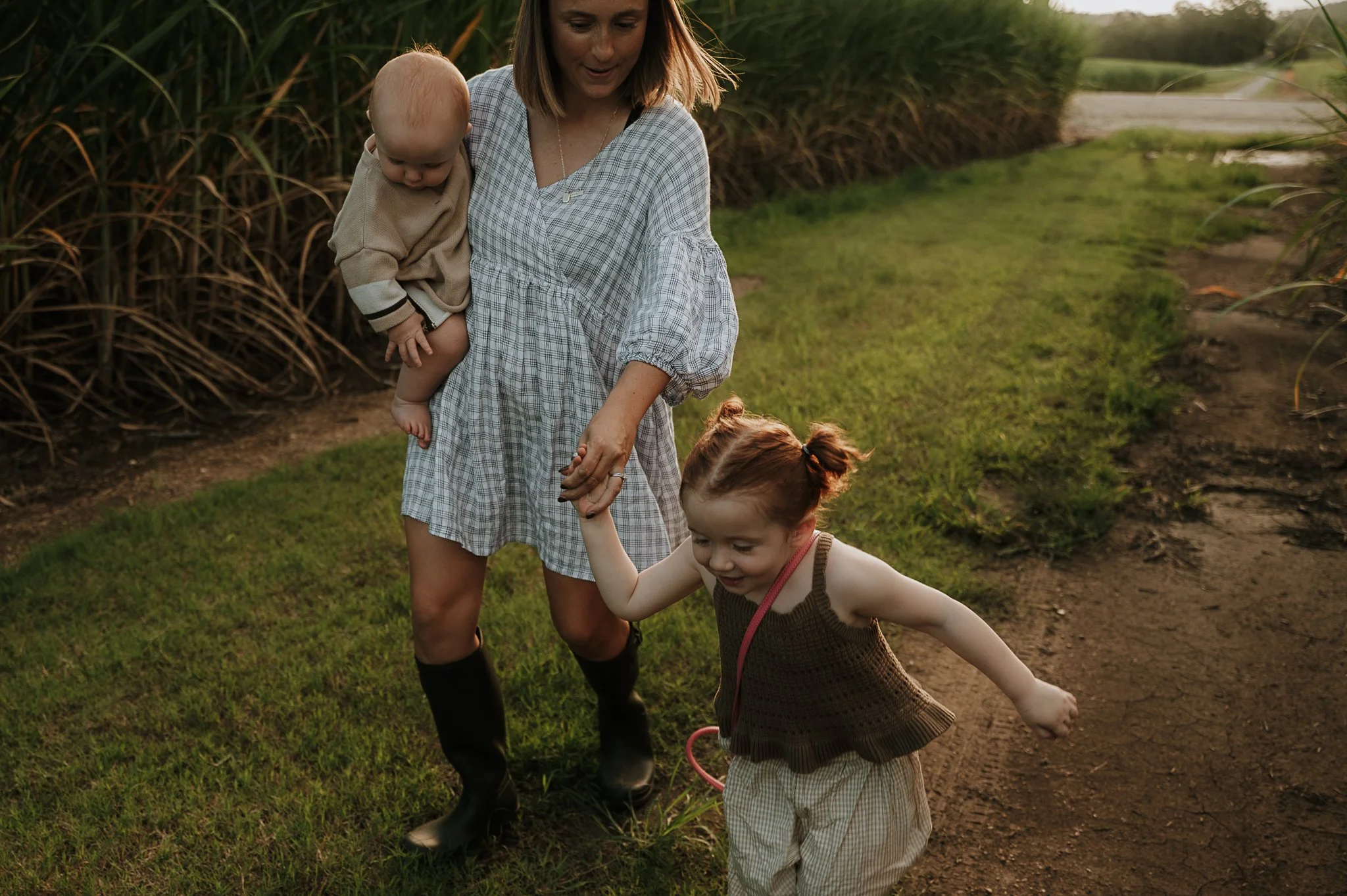 mother-walking-toddler-baby-sugar-cane-field.jpg