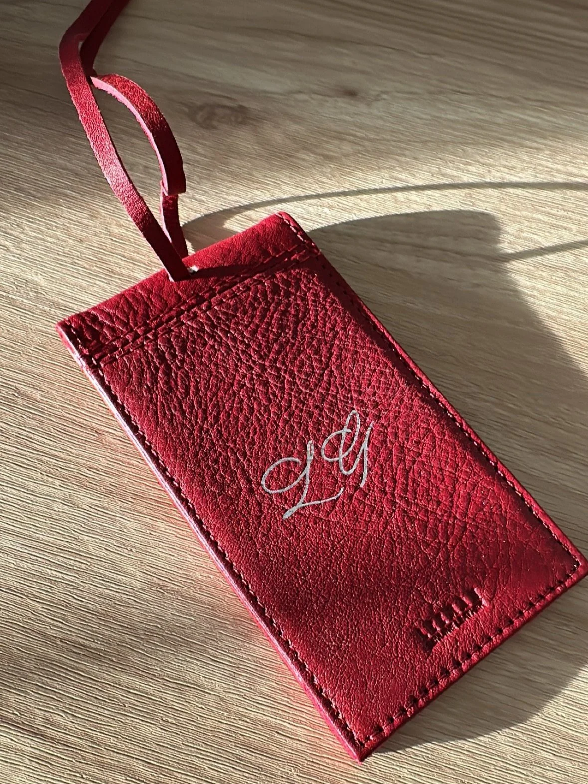 Live leather monogramming with gold foil for a luxury retail event in Short Hills, NJ.