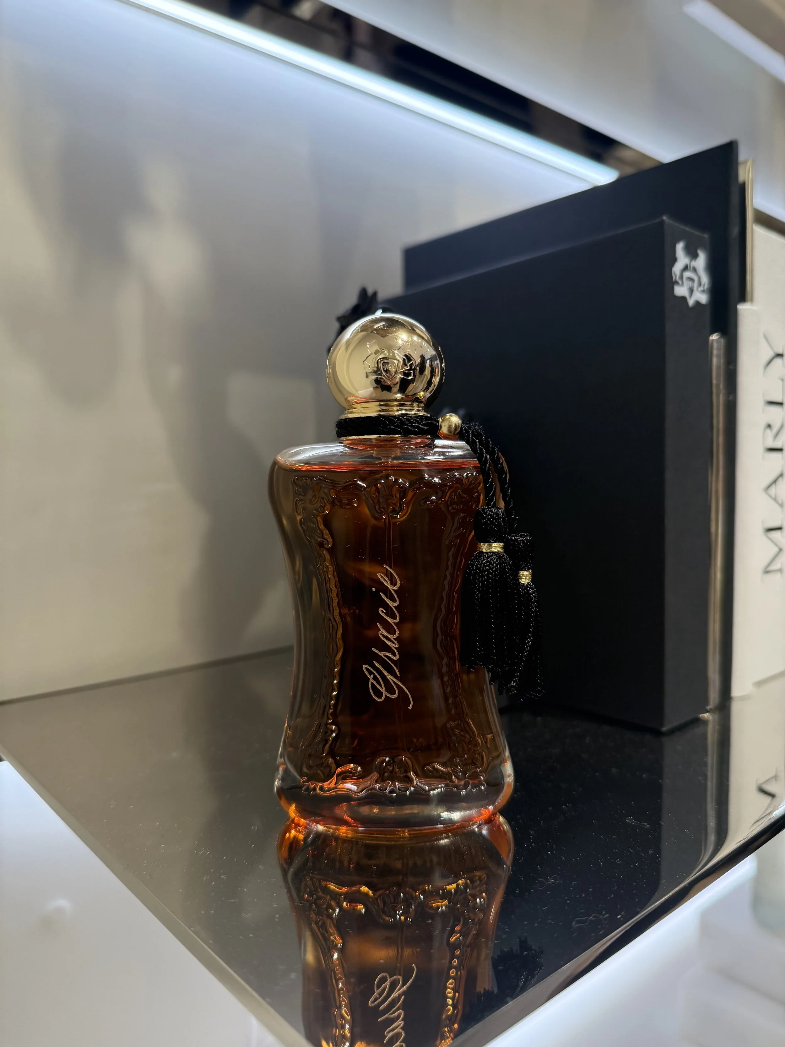 Luxury beauty bottle engraving at New York City retail event, nyc calligrapher, nyc calligraphy, new york calligraphy, bottle engraving nyc