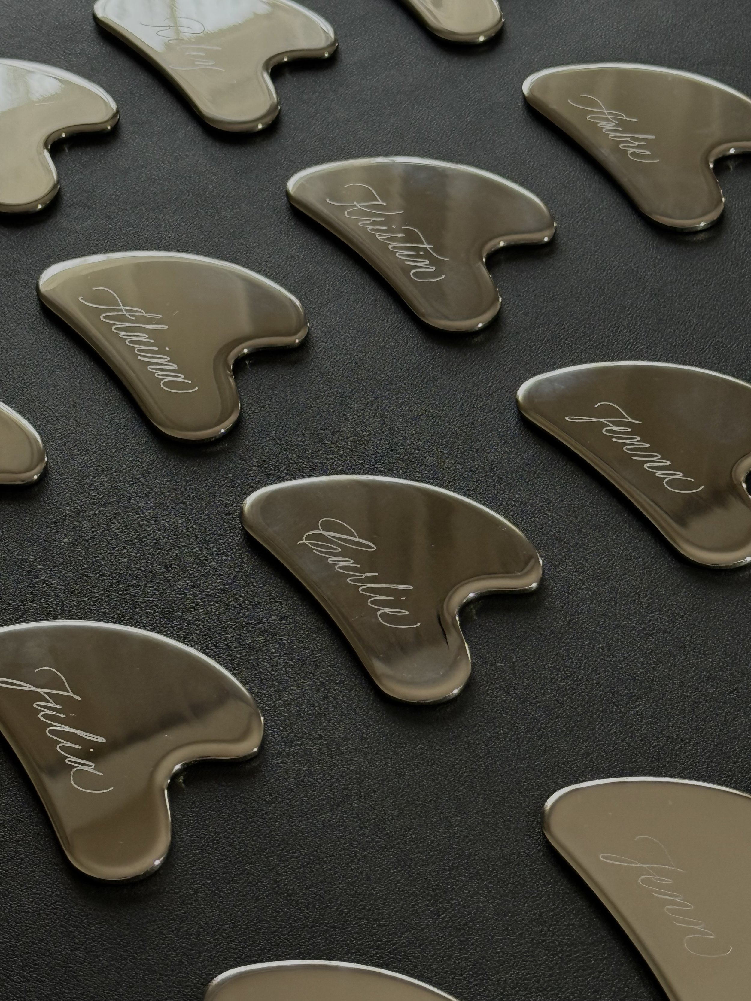 Custom hand engraved gua sha created by New York city calligrapher for luxury brand activation in NYC