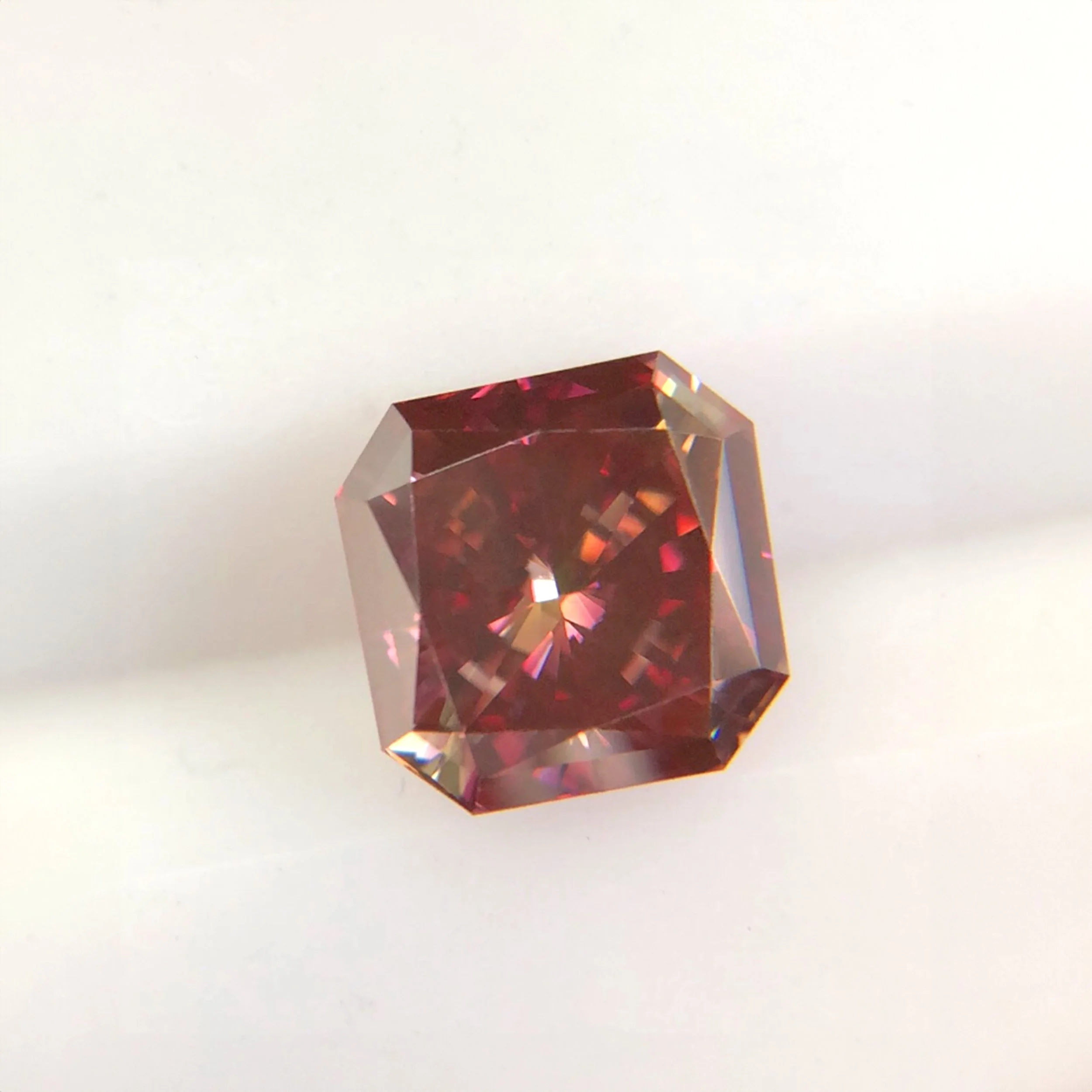 Radiant-cut red cremation diamond created from pet ashes, highlighting EverDear™'s craftsmanship and expertise in memorial diamonds.