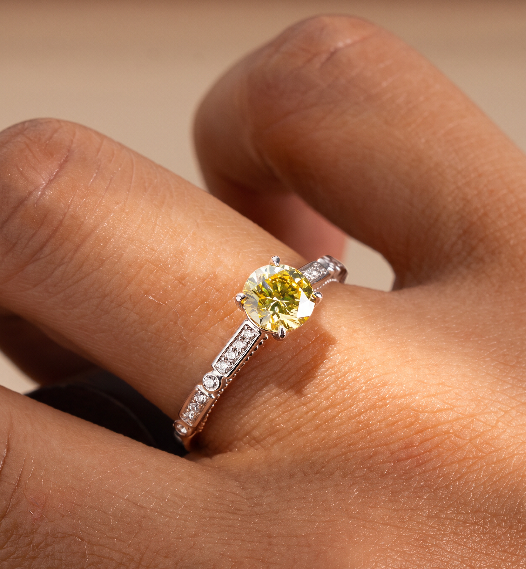 A round yellow EverDear memorial diamond in a white gold ring with small accent stones, worn on a hand.