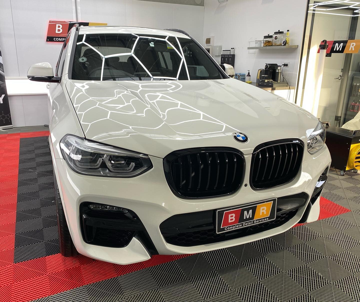 Brand new BMW X3 4.0i in for full front paint protection film. Bonnet, front bar, fenders, headlights &amp; mirrors all covered with Hexis Bodyfence self heal film. Rest of car has been sealed with Feynlab detailer until it gets some signage on the s