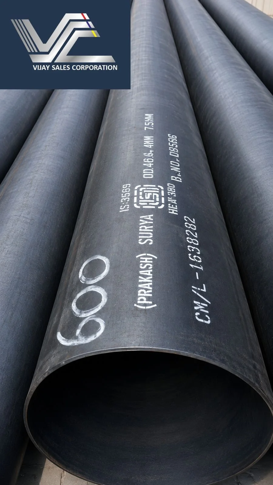 Large-diameter welded steel pipe stacked at the Vijay Sales Corporation yard in Delhi.