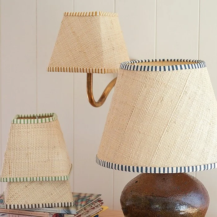 Striped trim raffia lampshades give a summertime feel to any room. Available in bespoke sizes.

#raffia #lampshades #handmade #interior #stripes