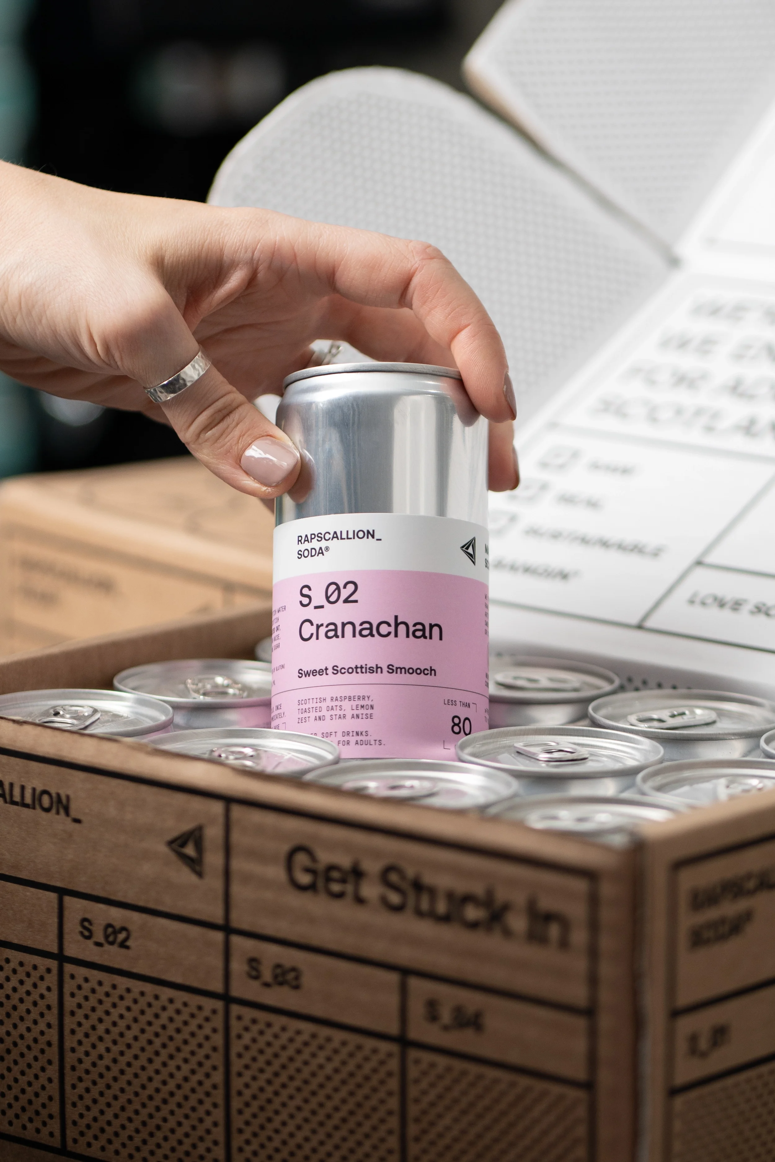 Rapscallion Soda can being removed from Packing box, Glasgow Home studio product photography