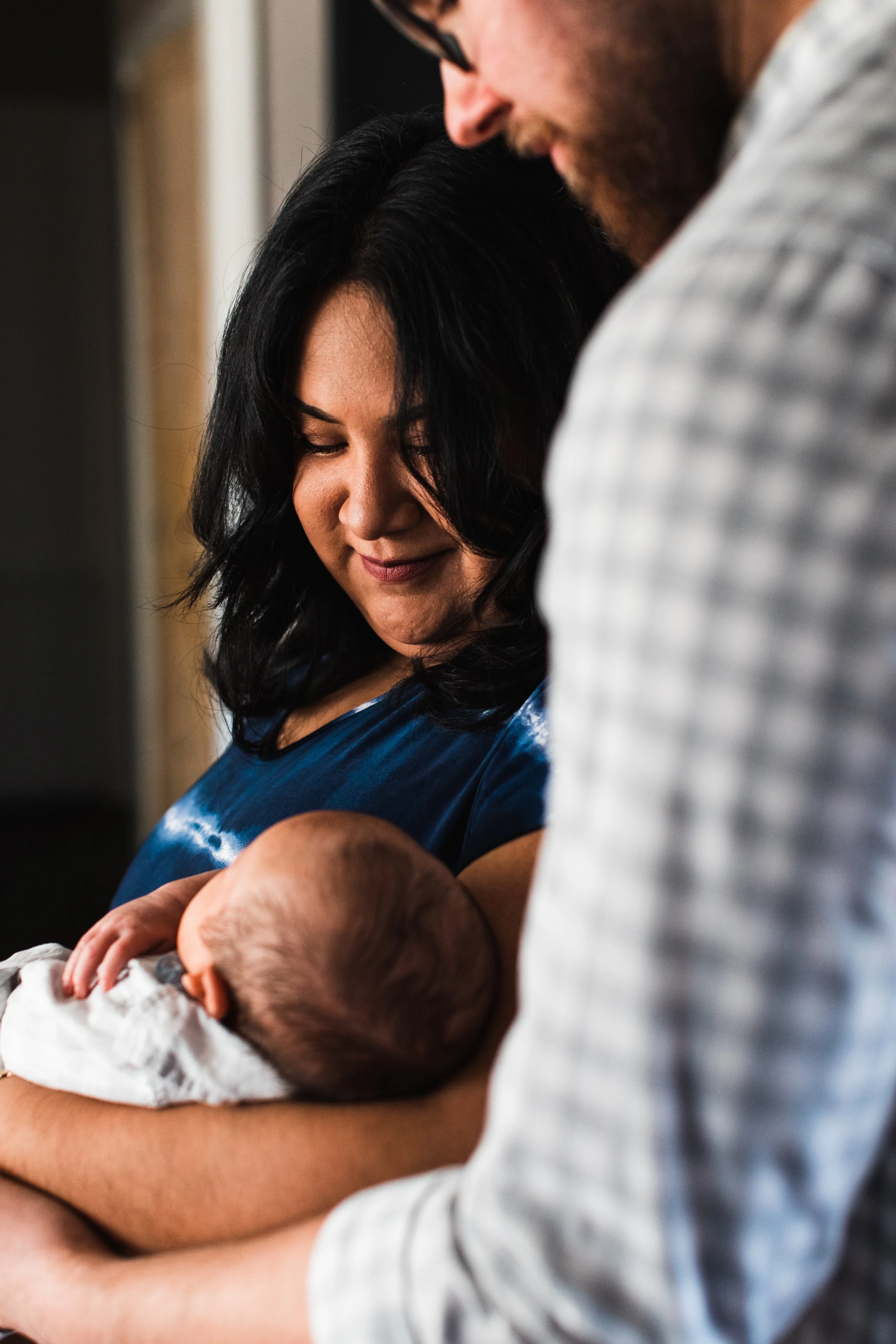 Mom and dad holding newborn baby