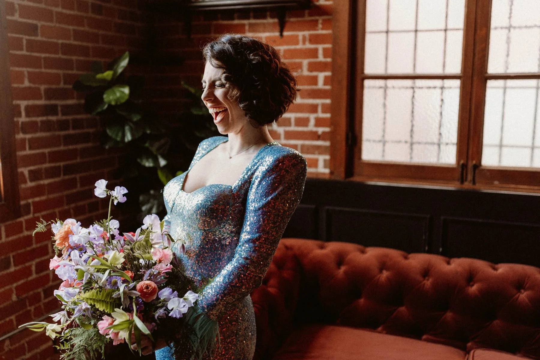 glamorous-bride-in-sequin-dress-with-colorful-bouquet-at-carondelet-house.jpg