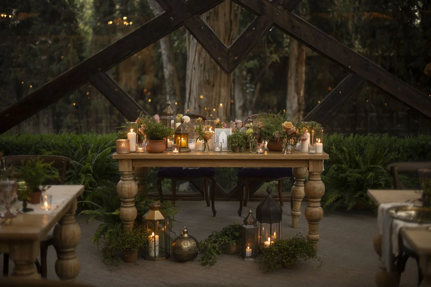 Lord of the Rings Inspired Wedding Head Table with Lanterns Plants and Florals