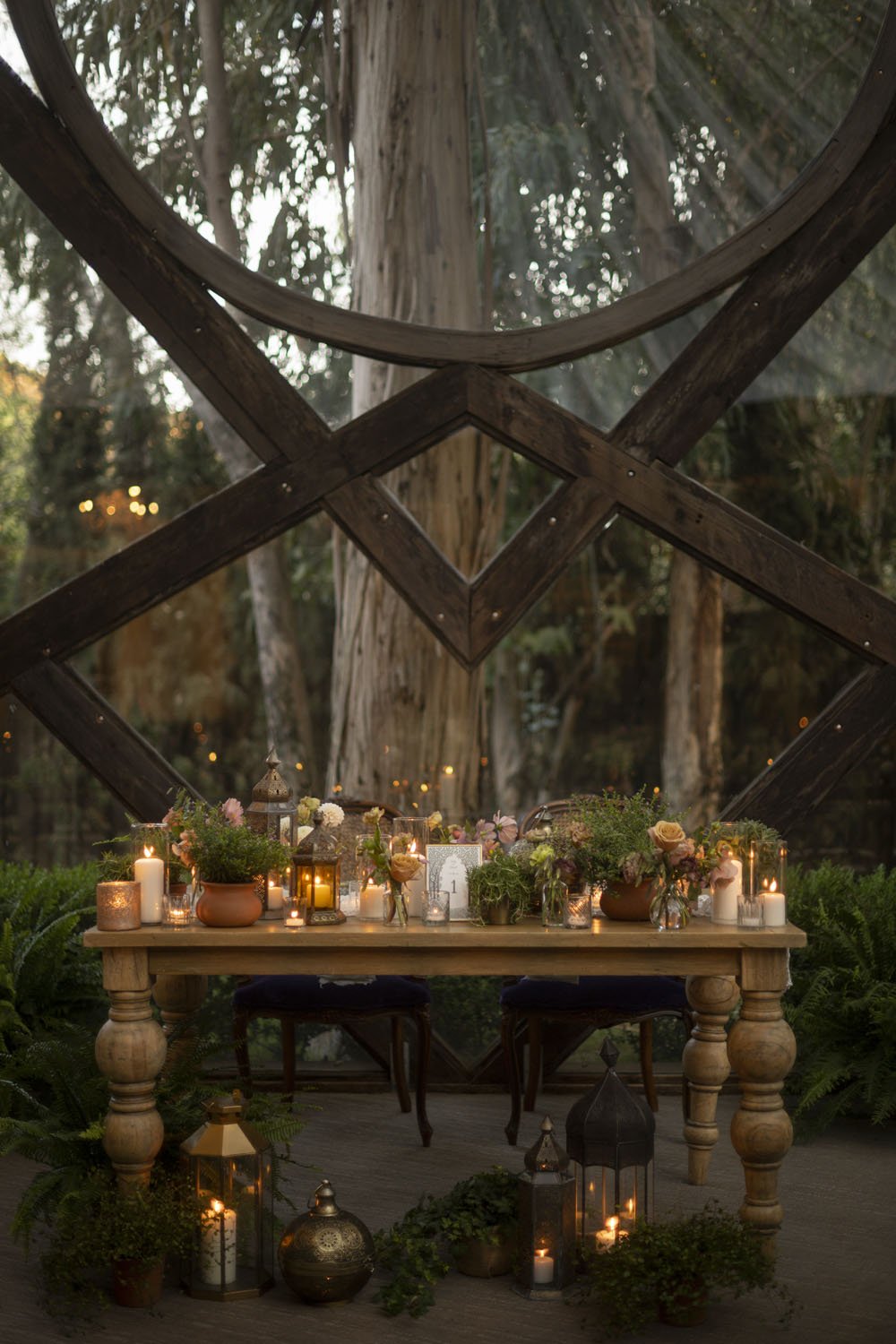 lord-of-the-rings-inspired-wedding-sweetheart-table-with-lanters-plants-and-florals.jpg
