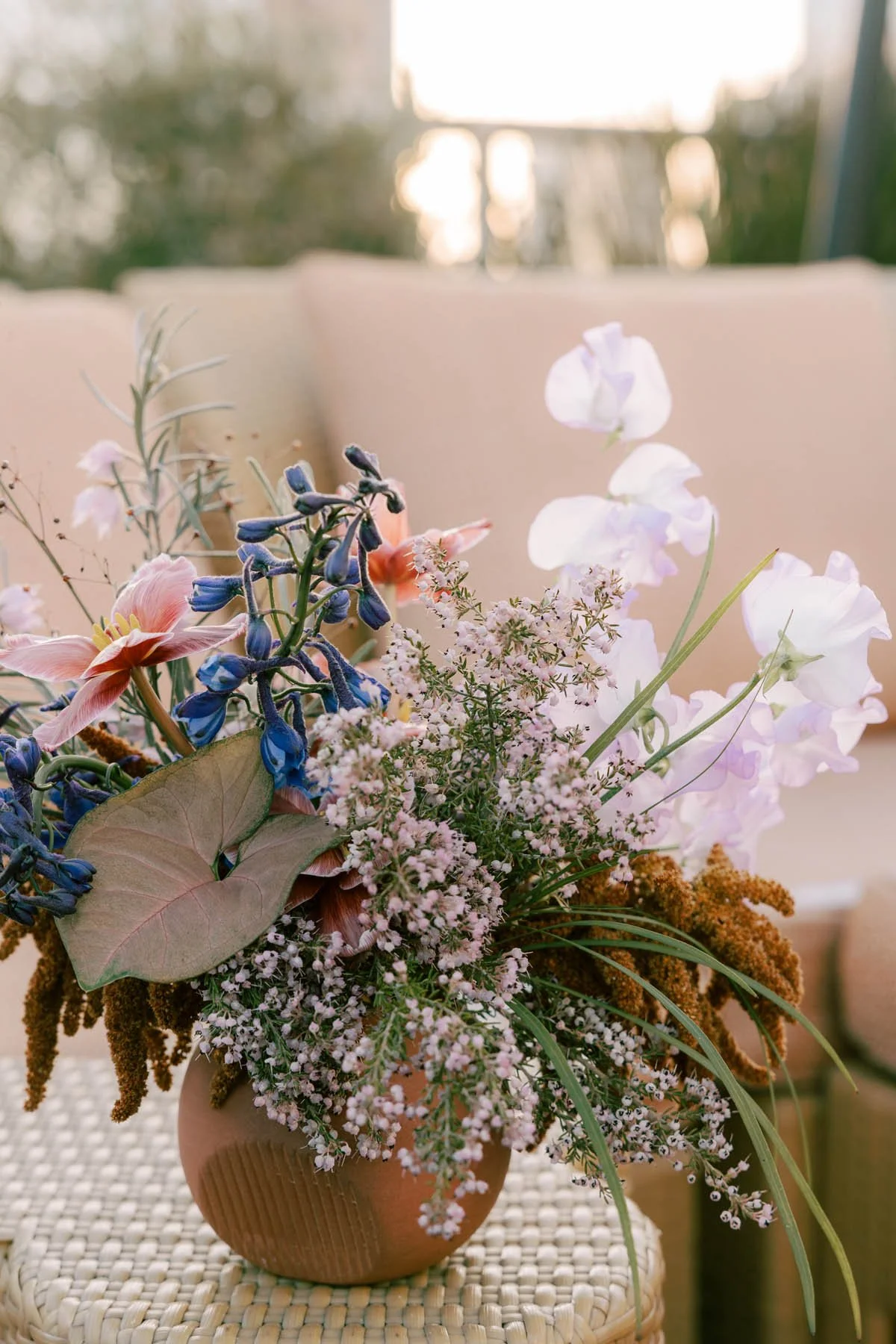 Terracotta Vase with Spring Wildflowers in Blush and Indigo.jpg