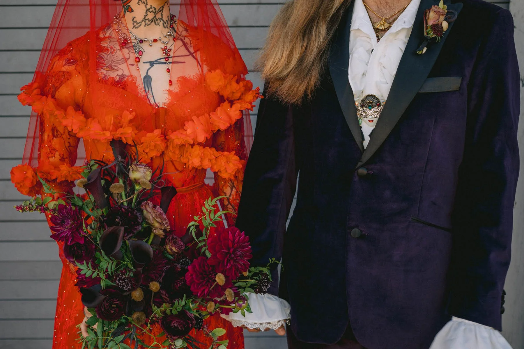 Gothic Wedding Couple with Dramatic Florals and Velvet Tuxedo 