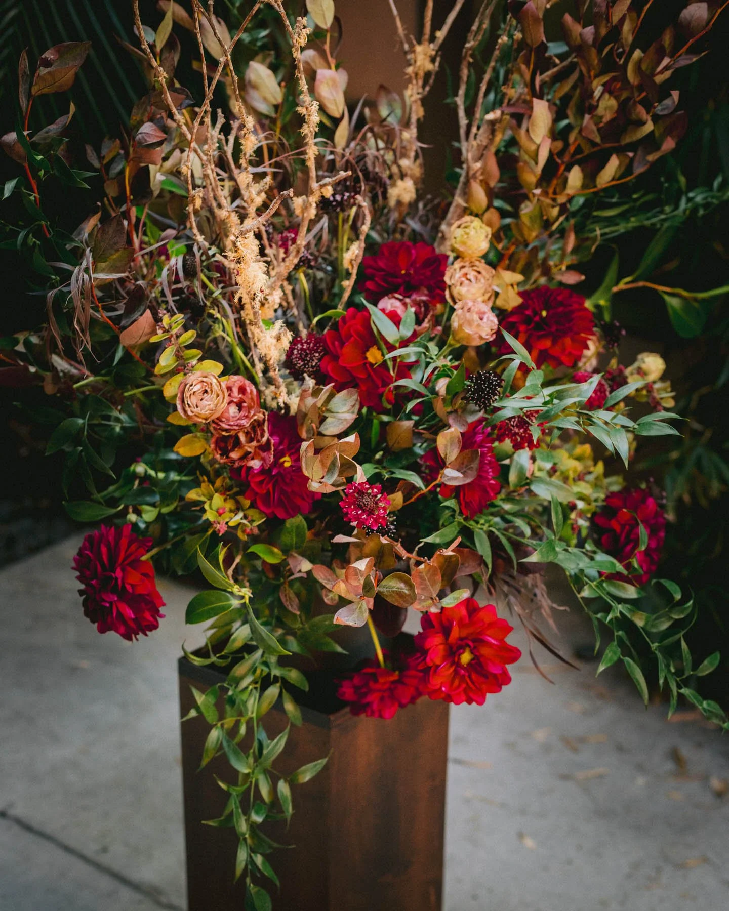Autumnal Wedding Floral Arrangement with Crimson Dahlias and Wild Branches