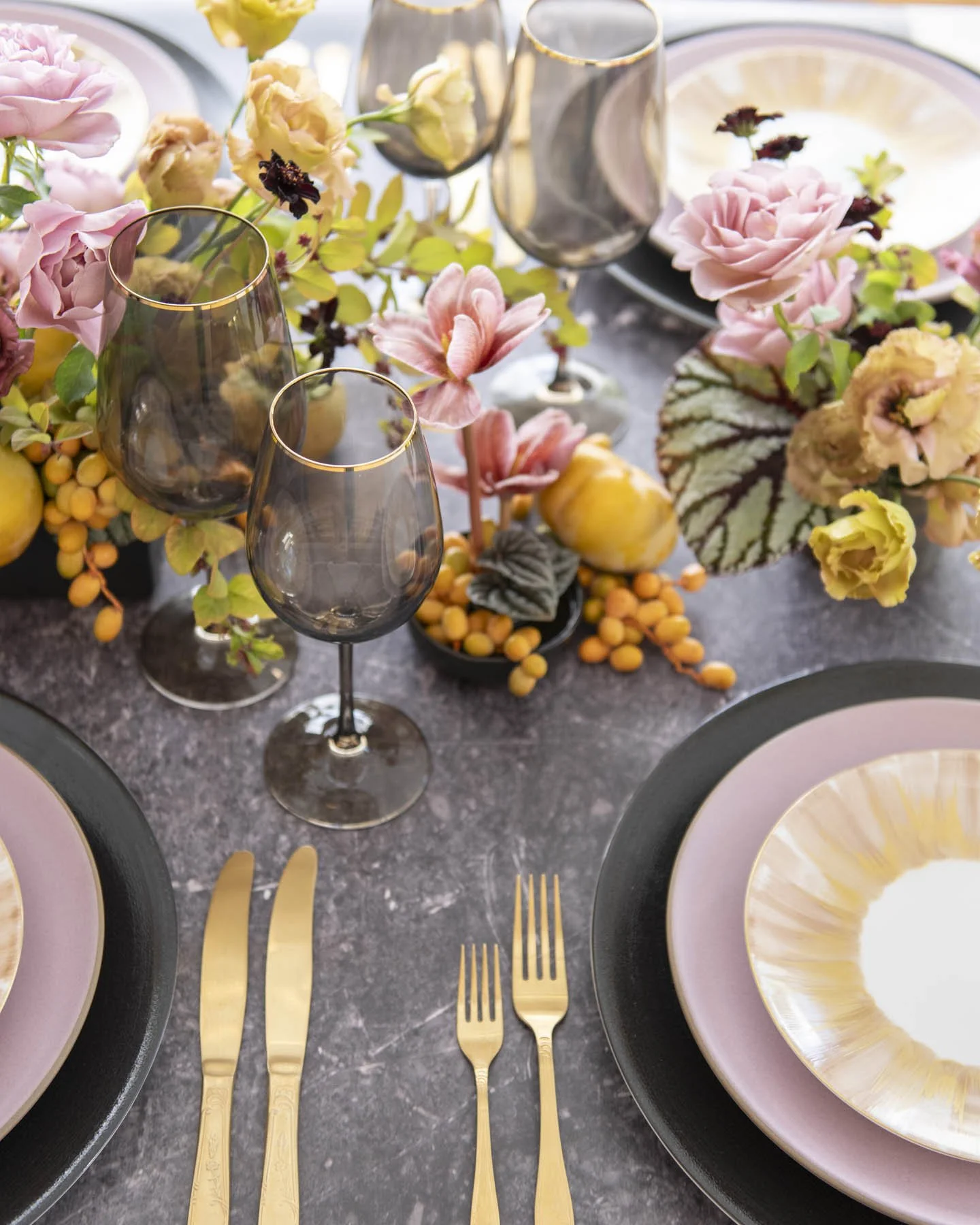 Floral and Fruit-Inspired Wedding Tablescape with Gold Flatware and Smoky Glassware