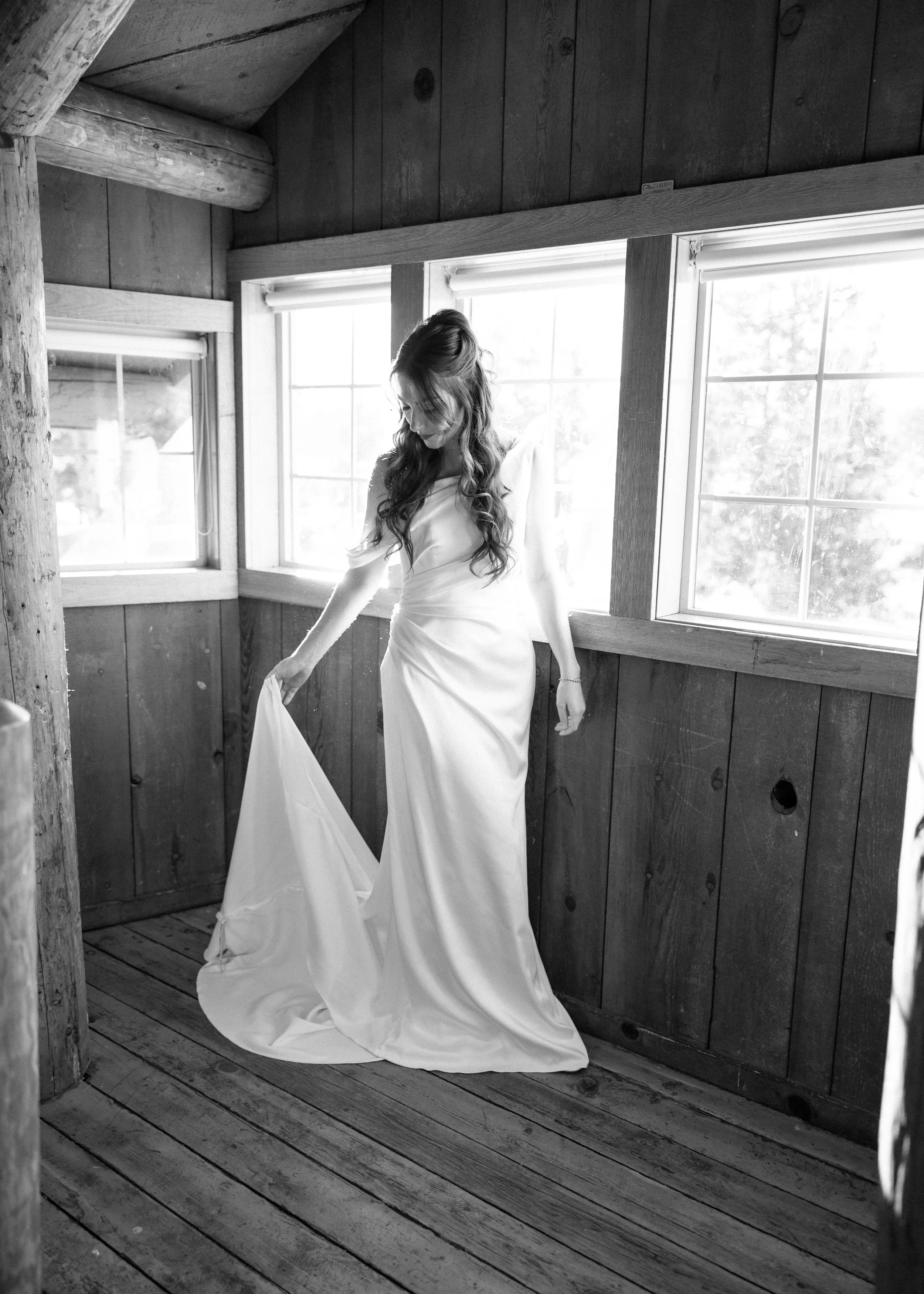 bride lifting train of her wedding dress