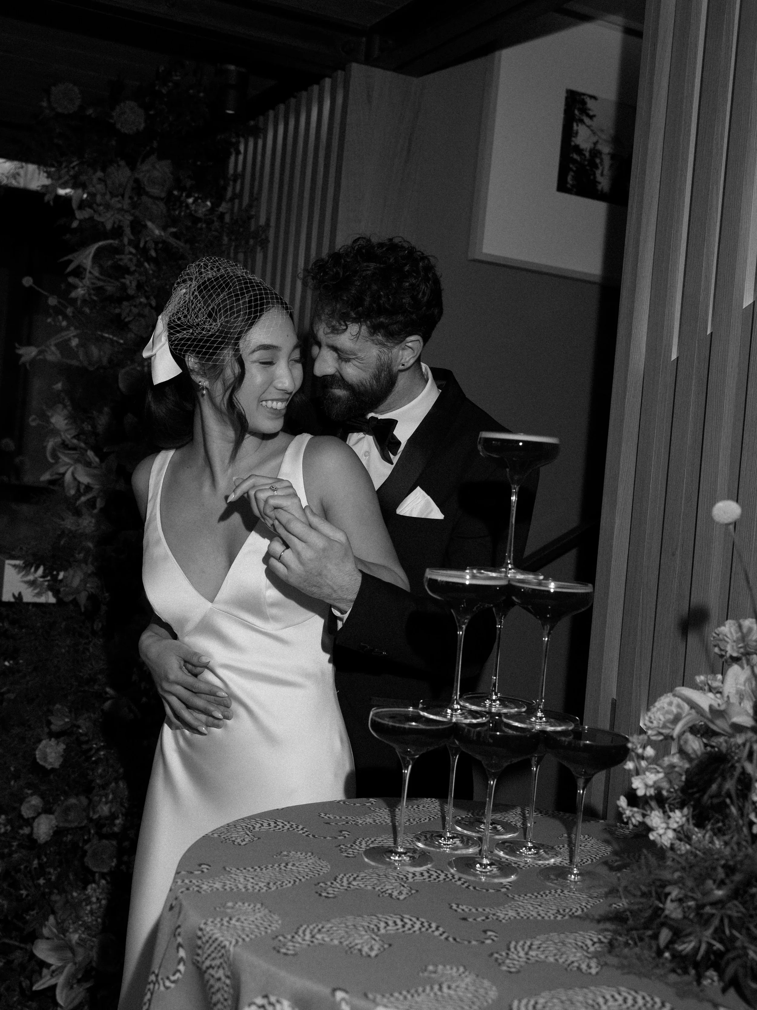 bride-and-groom-laughing-in-front-of-espresso-martini-tower.jpg