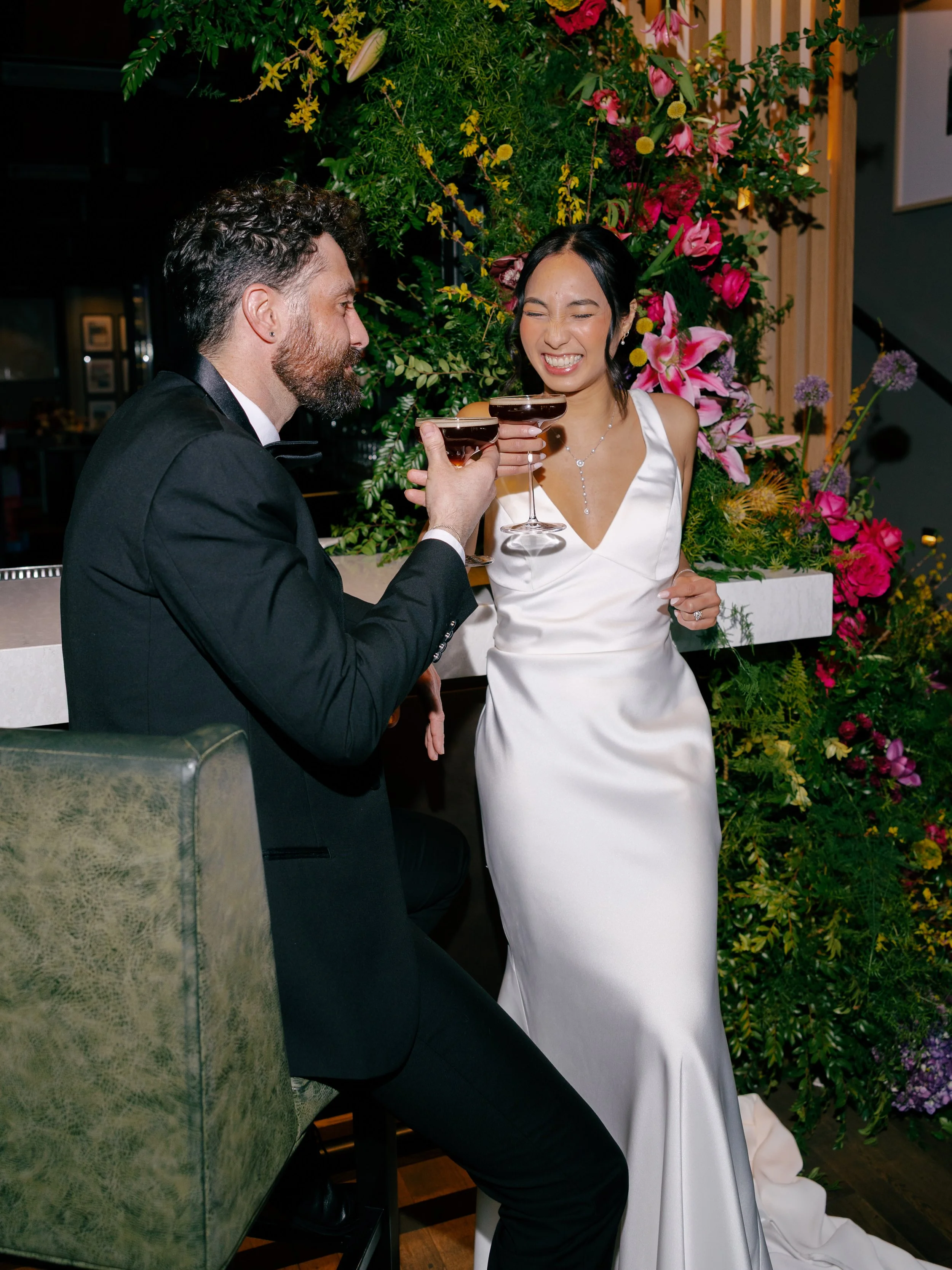 bride-and-groom-cheersing-espresso-martinis.jpg