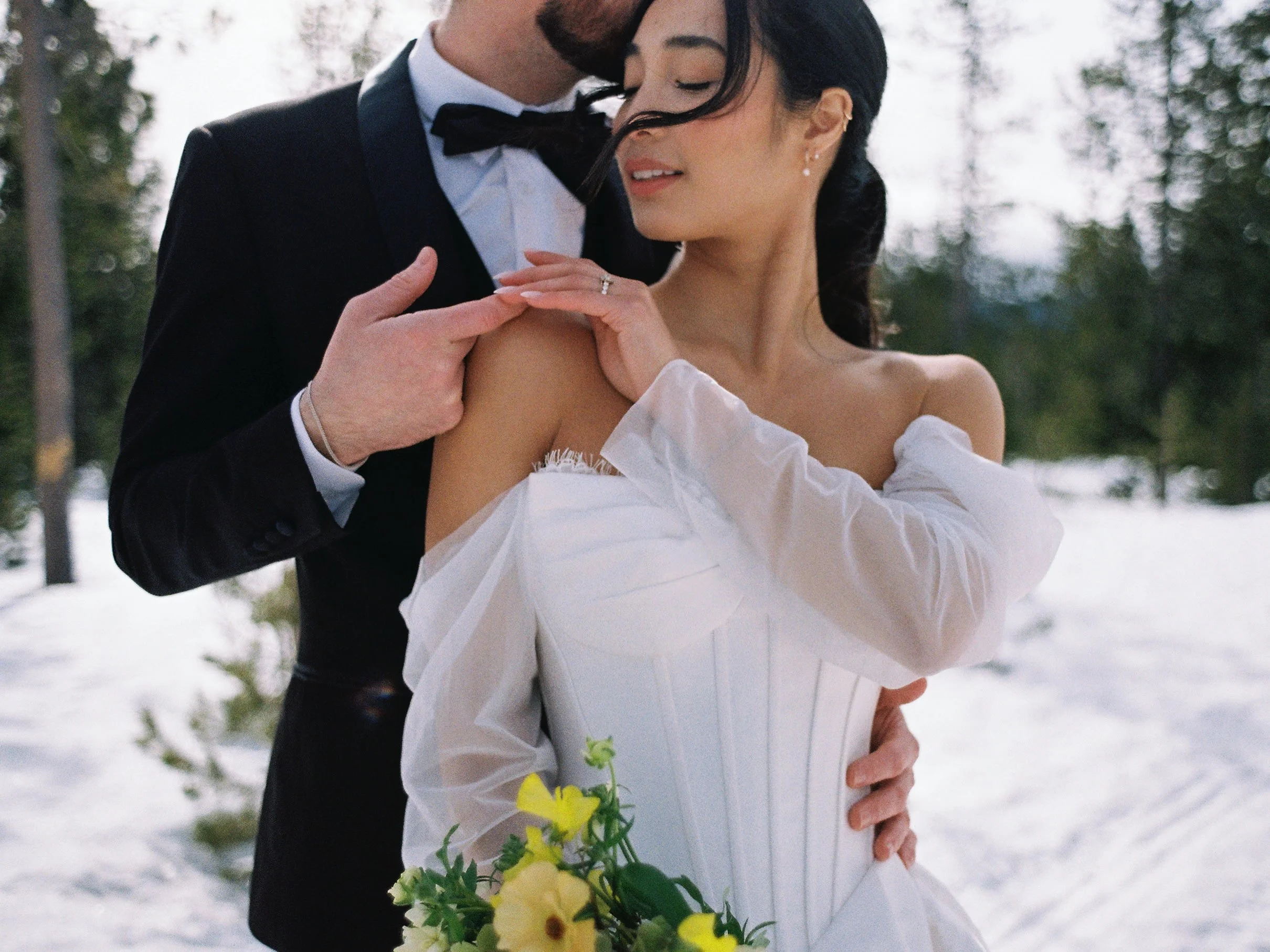 detail-shot-of-bride-reaching-across-her-body-for-grooms-hand.jpg