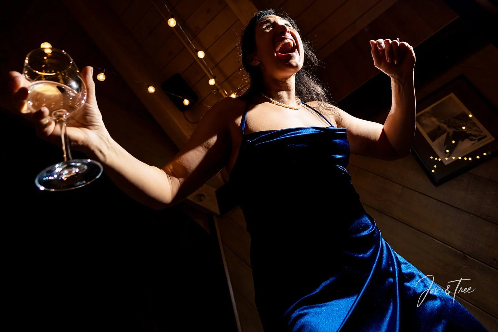 bridesmaid-dancing-holding-wine.jpg