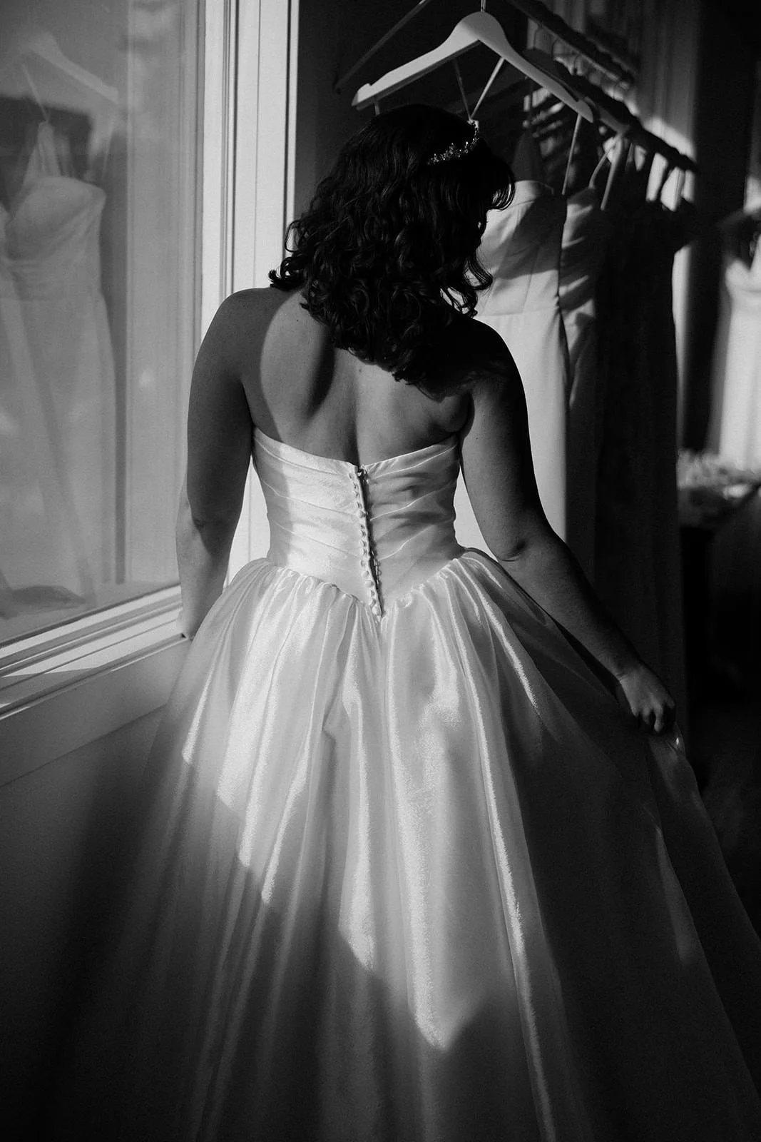 back view of bride wearing basque waist ballgown