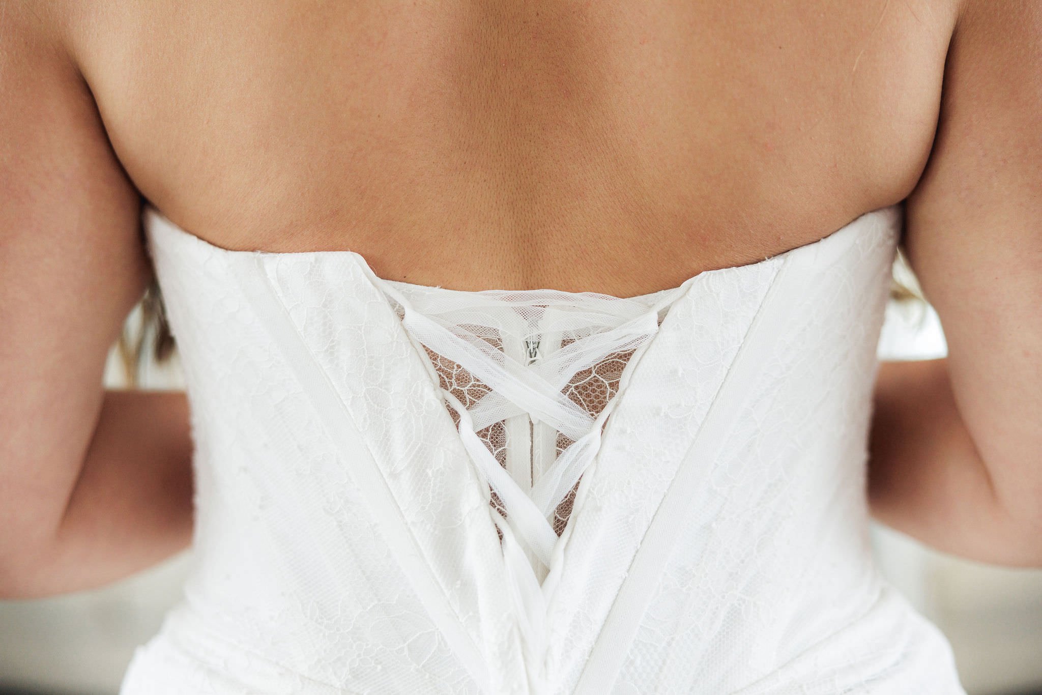 close up photo of tulle and lace corset back dress