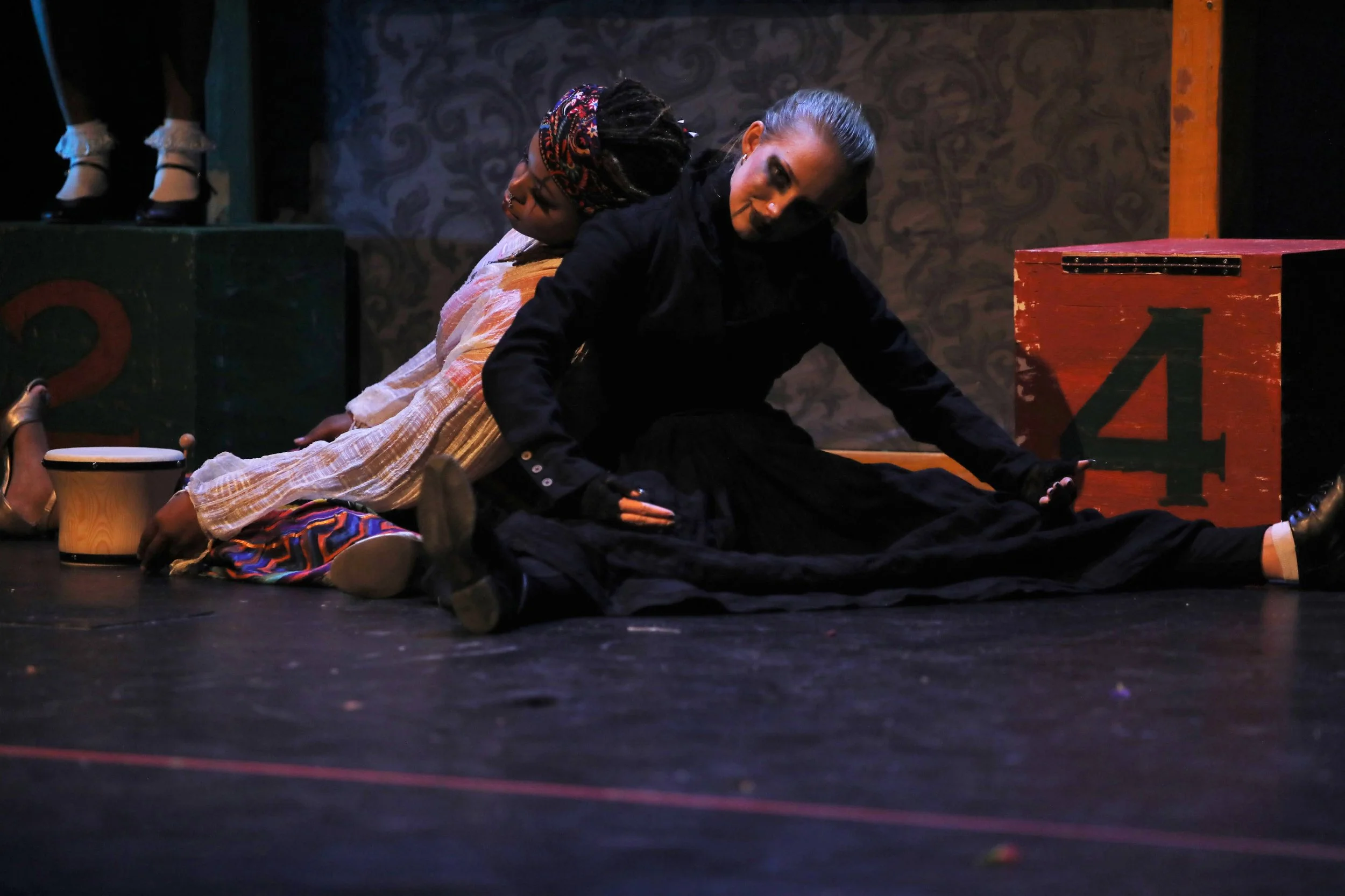 Styled a black corset with a long black skirt to create a goth doll look and ensured the waist was tight waist as to make it appear smaller. Extenuated features through lighter white makeup and dark eyeshadow and eyeliner.