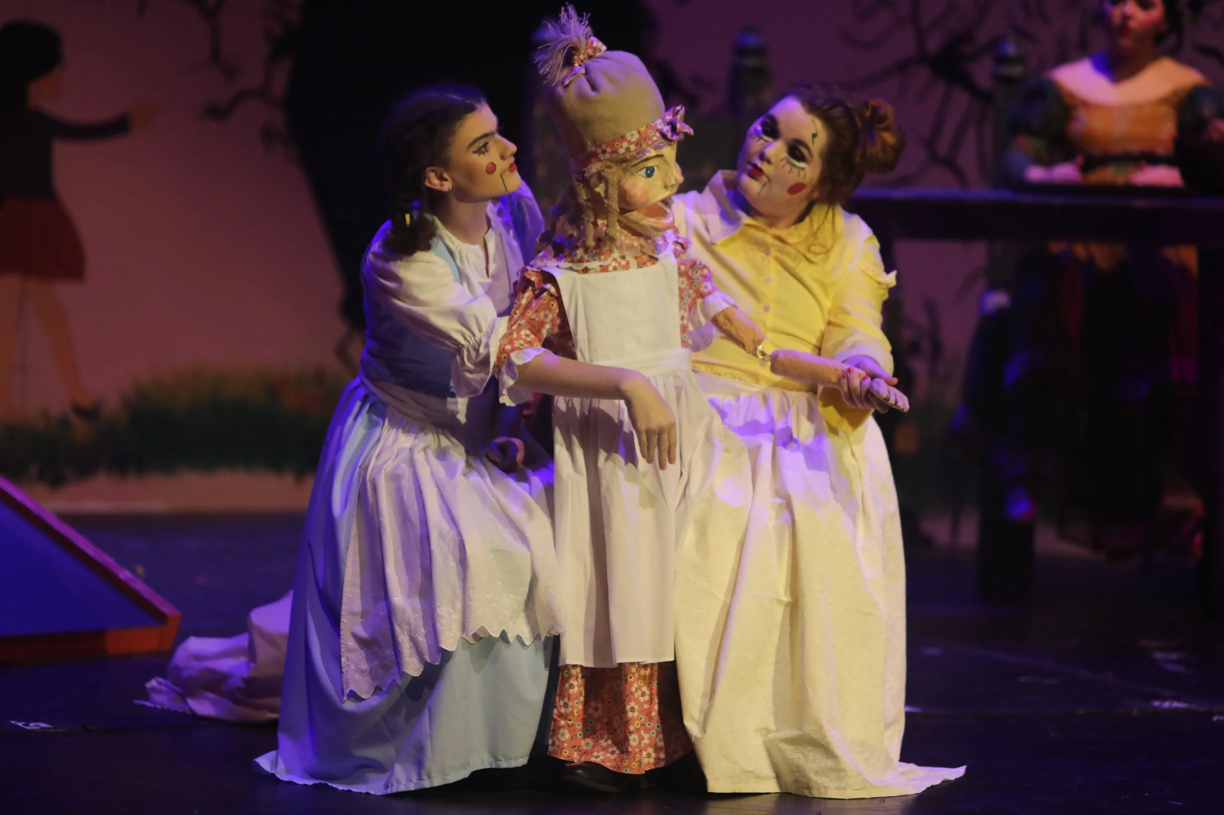 I constructed the yellow and blue dress for these two individuals within the play as to correspond with the puppet that they maneuver. The puppets dress (Beatrice) is covered in blue and yellow flowers, therefore I wanted to extenuate those minor det