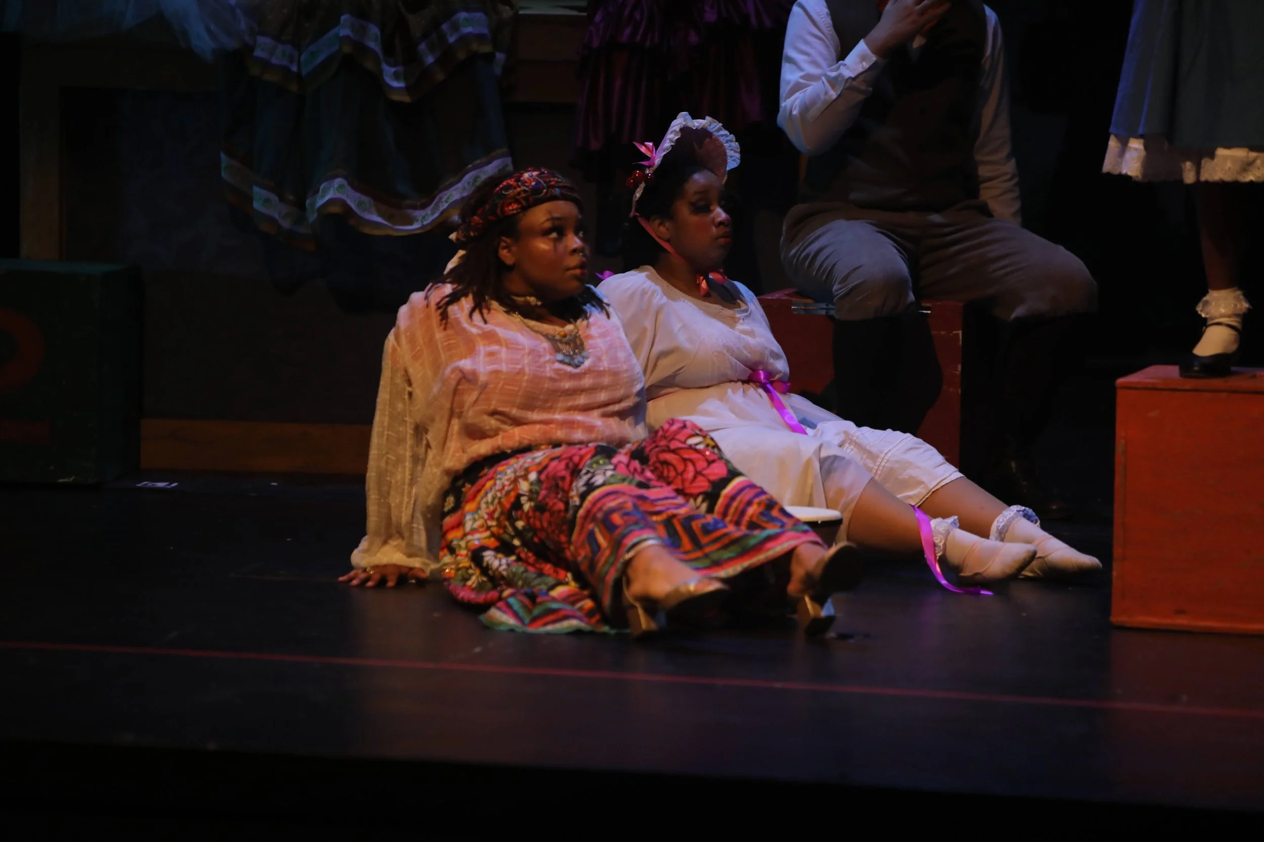 Gypsy doll inspired look with a multicolored floral printed skirt paired with a red body suit topped with a sheer slightly ripped top