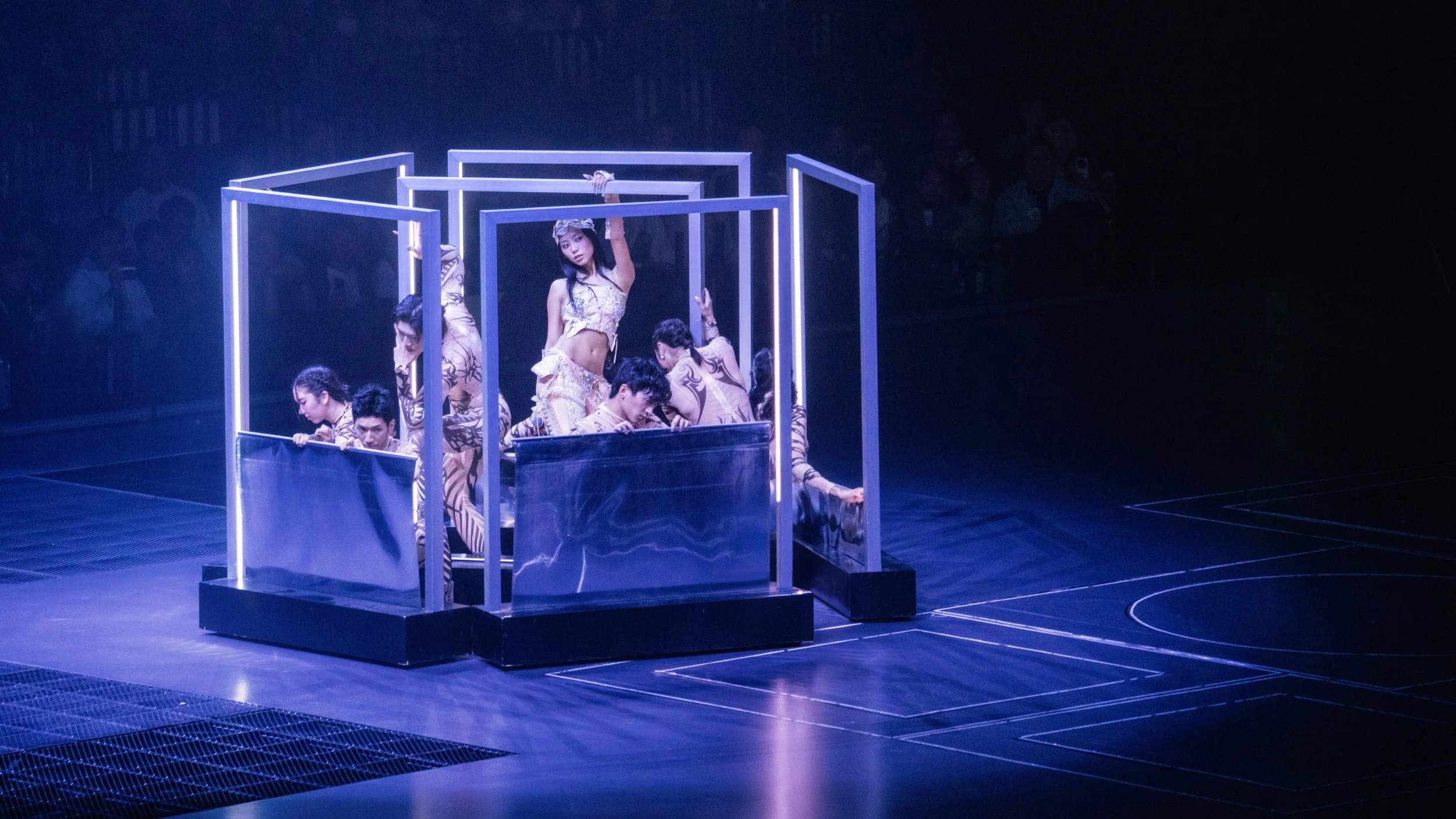 Jace World pop concert featuring reflective mirror panels and immersive blue lighting design, stage design by London set designer Ruby Law.