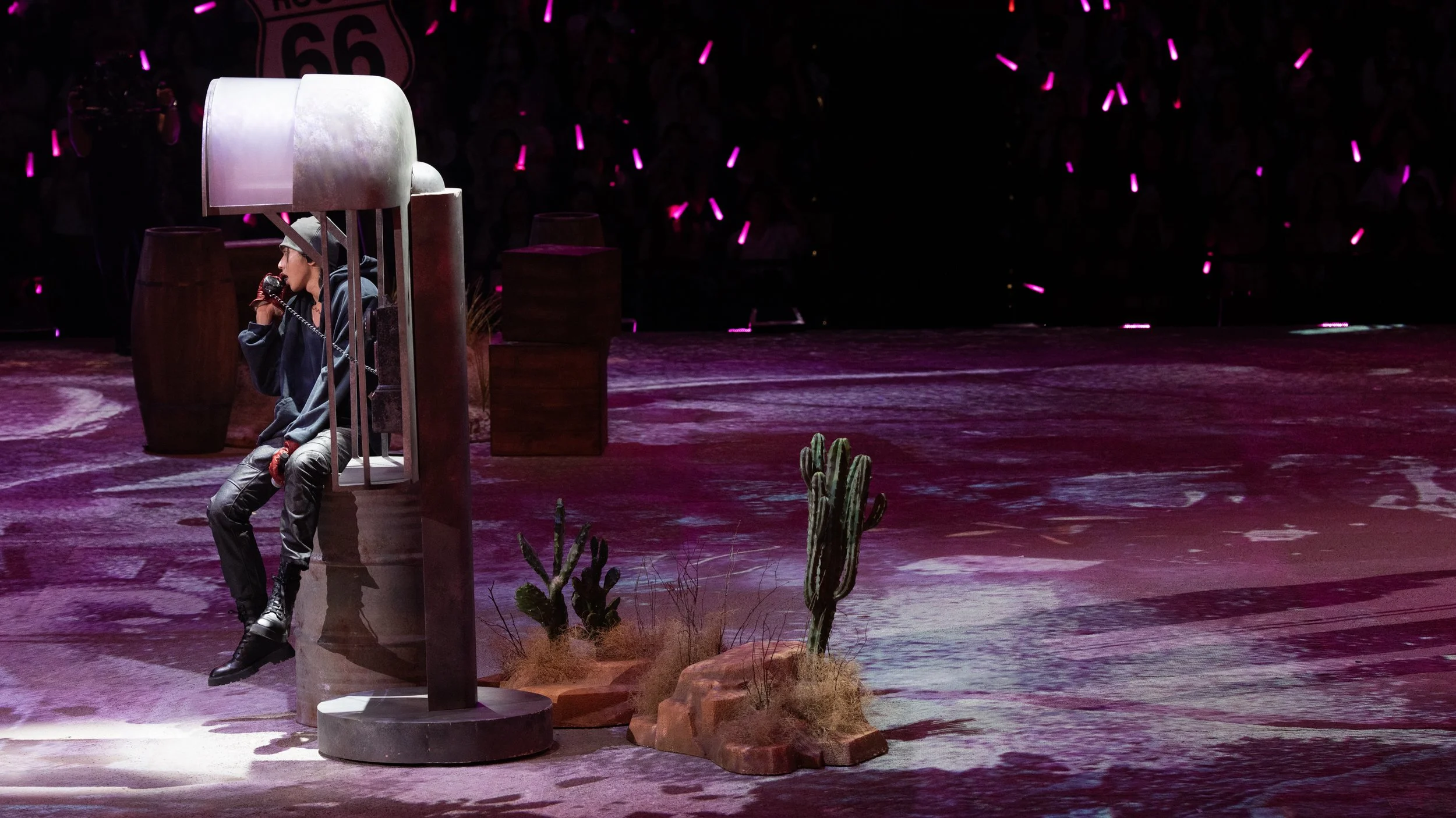 KUN 蔡徐坤 at a roadside phone booth within the surreal Western landscape of DEADMAN, set design by Ruby Law
