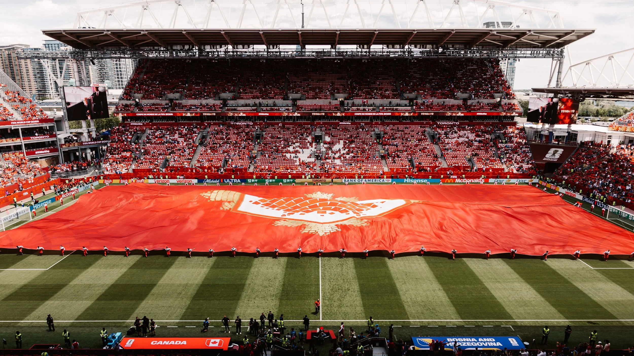 Maple leaf field cloth revealing a mosaic pattern during the FIFA World Cup 2026 Toronto Opening Ceremony set design by Ruby Law.